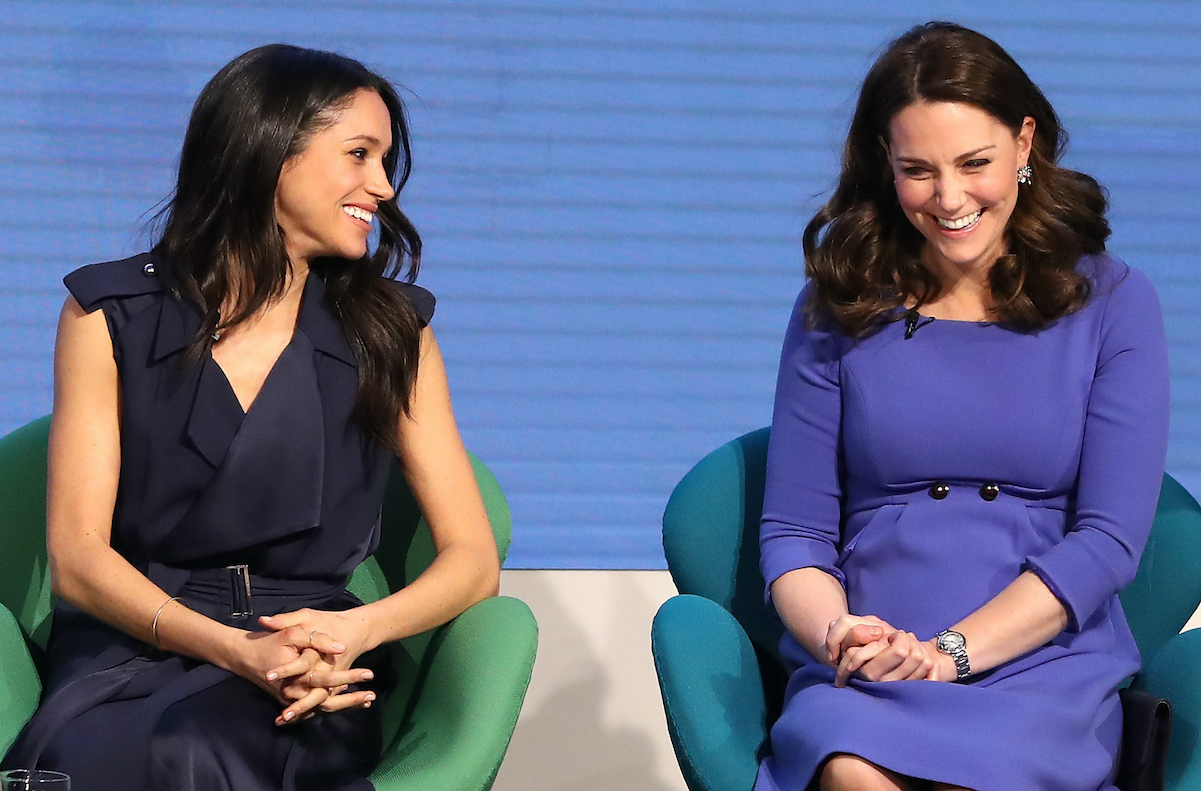 Meghan Markle and Kate Middleton share a laugh in February 2018
