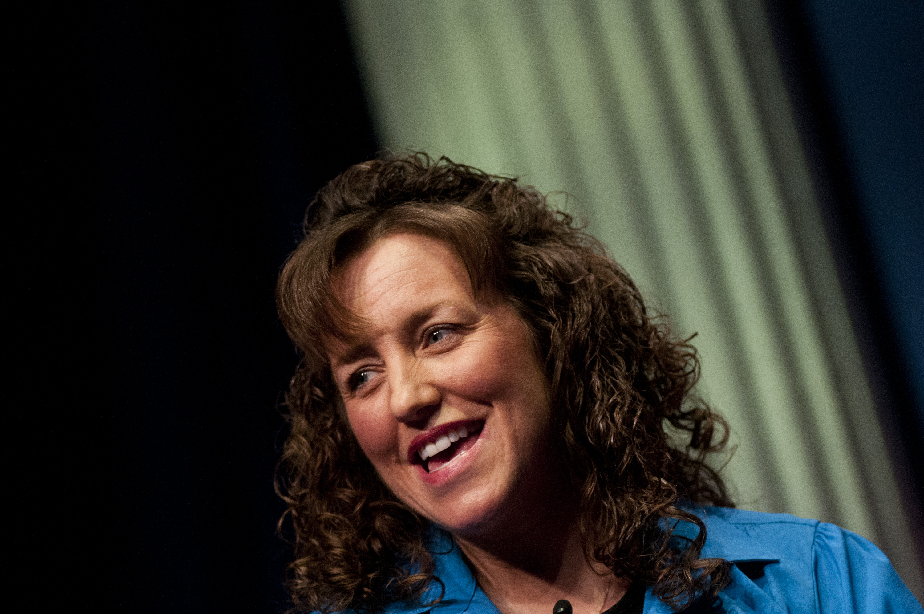 Angled photo of Michelle Duggar in front of a column