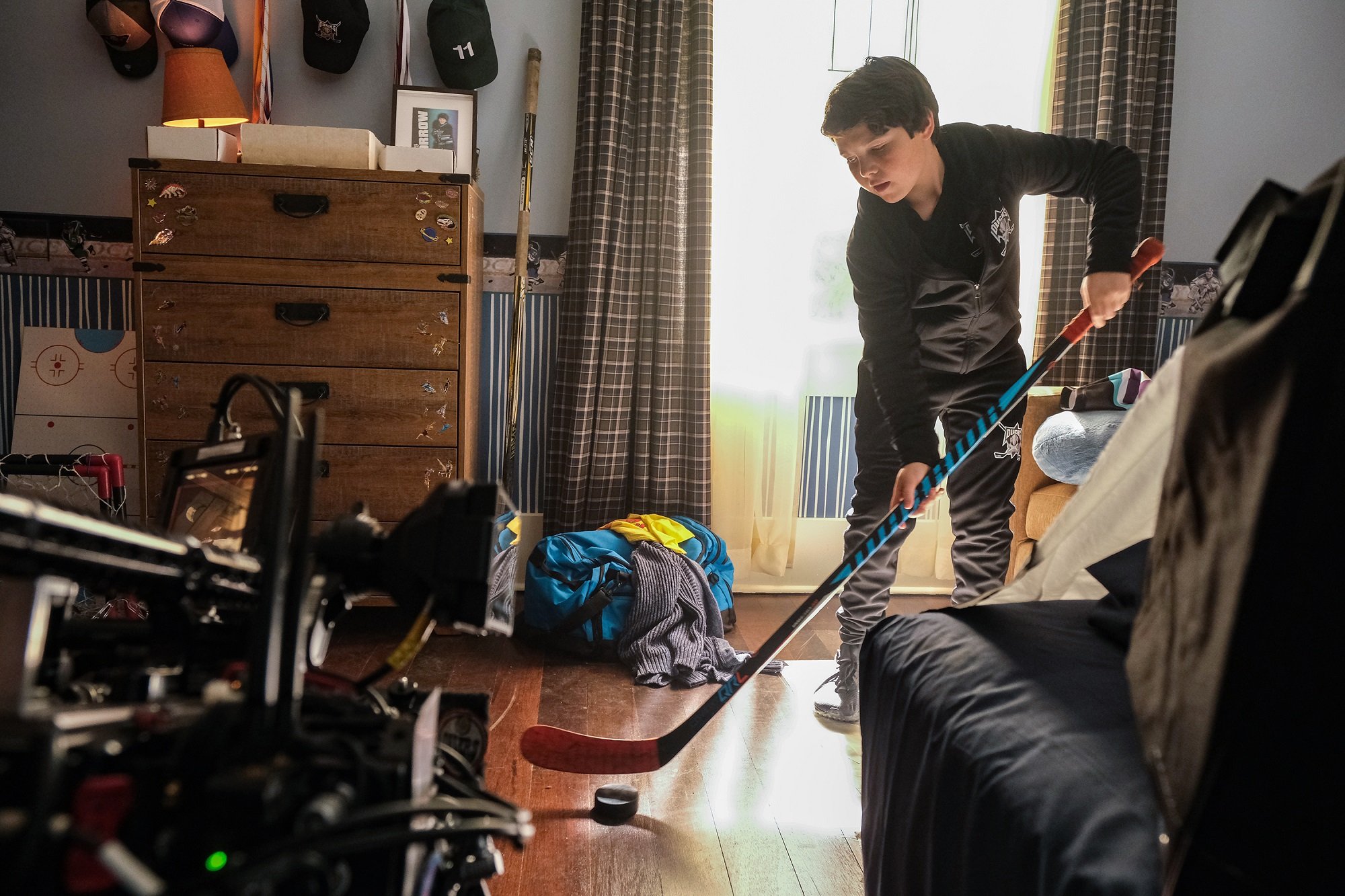 Mighty Ducks: Game Changers star Brady Noon plays hockey in his bedroom