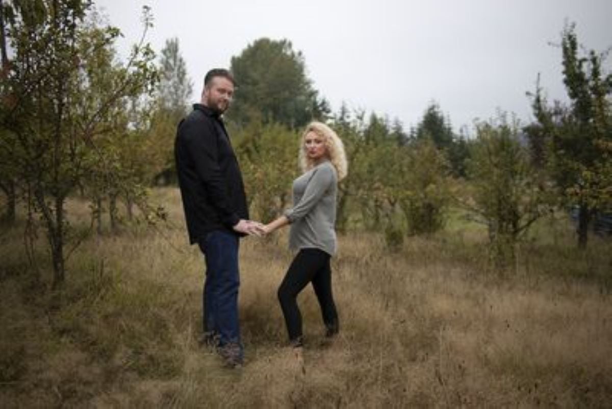 Mike and Natalie from '90 Day Fiancé' hold hands standing far apart.