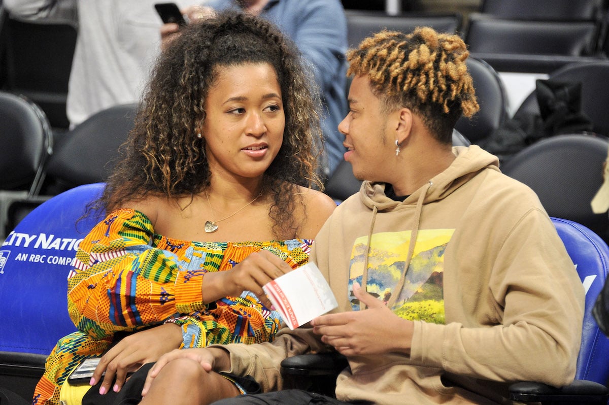 Naomi Osaka and YBN Cordae attend a basketball game between the Los Angeles Clippers and the Washington Wizards at Staples Center on December 01, 2019 in Los Angeles, California.