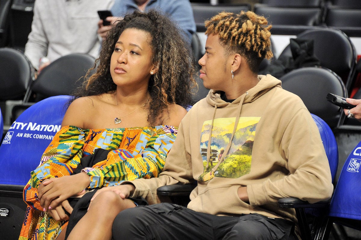 Tennis star Naomi Osaka and rapper Cordae attend a basketball game between the Los Angeles Clippers and the Washington Wizards at Staples Center on December 1, 2019, in LA