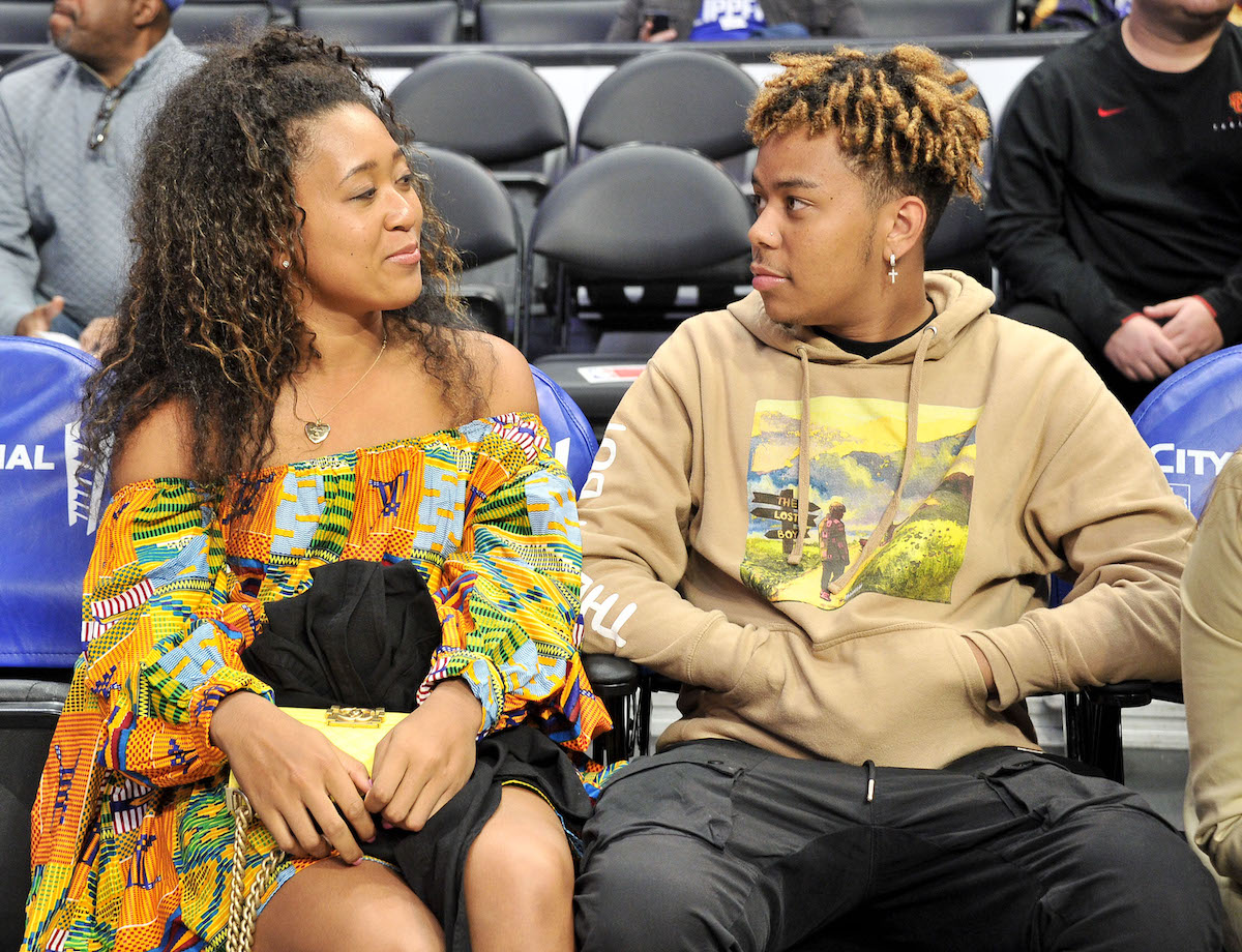 Naomi Osaka and YBN Cordae attend a basketball game between the Los Angeles Clippers and the Washington Wizards at Staples Center on December 1, 2019, in Los Angeles, California.