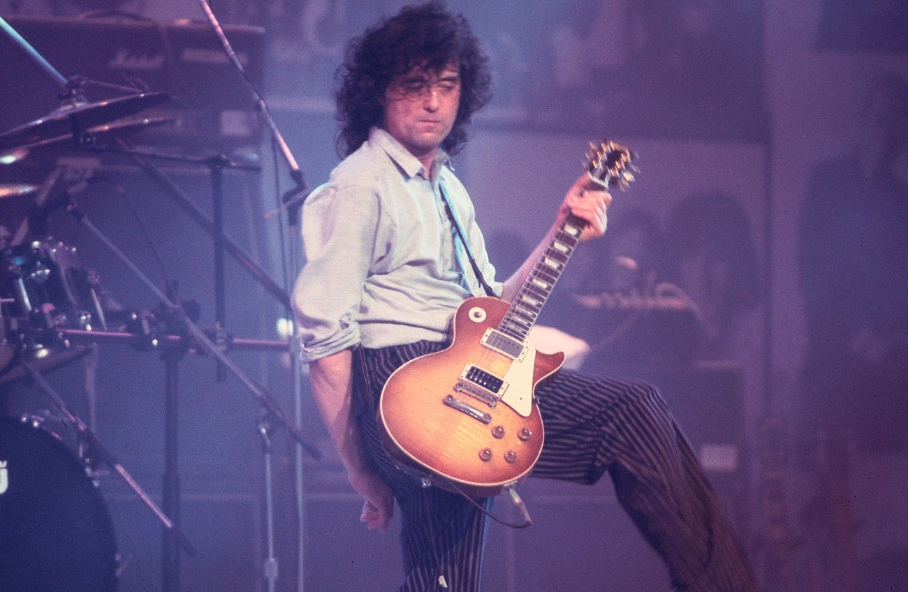 Jimmy Page playing guitar on stage in 1988
