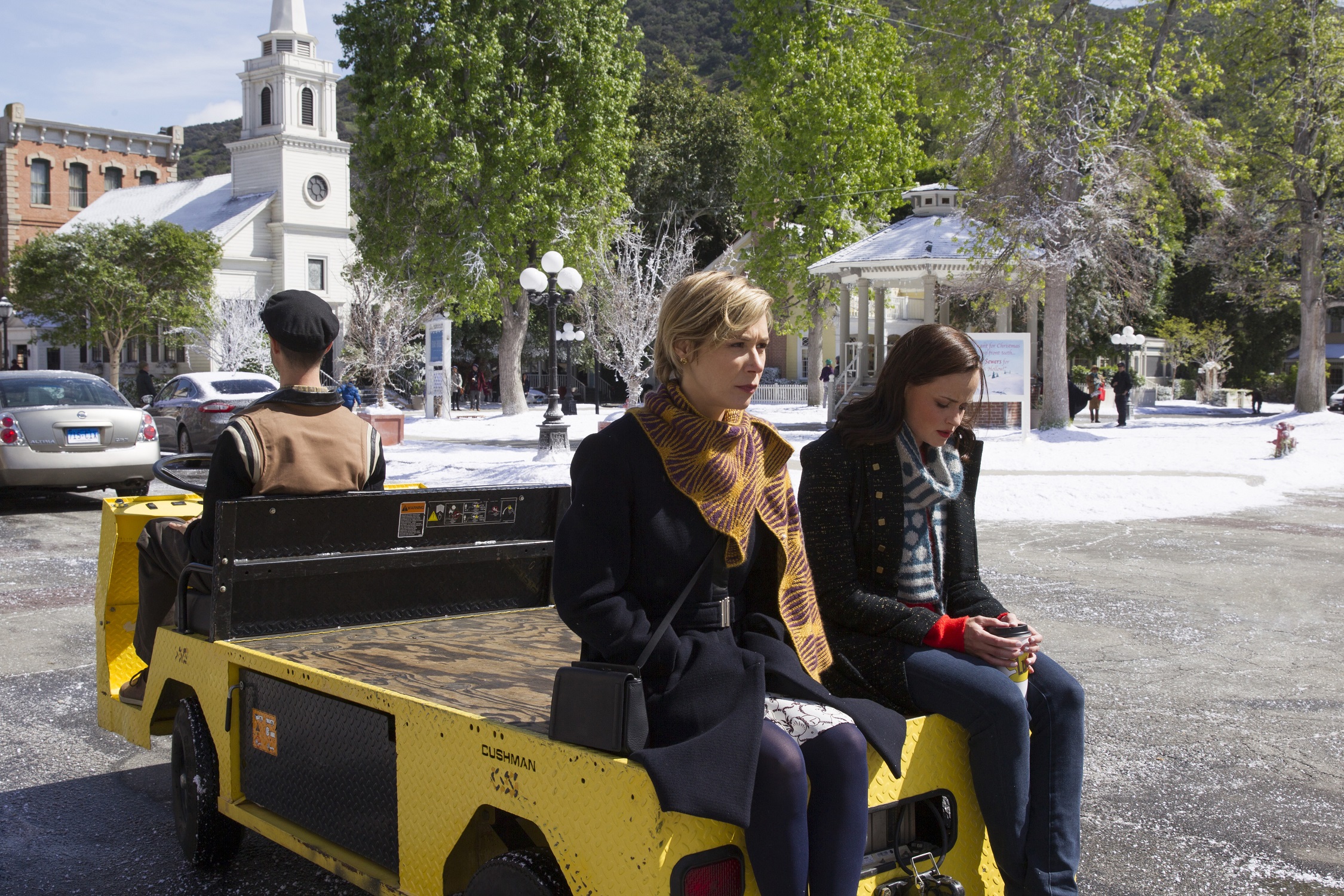 Paris and Rory ride on the back of a golf cart in Stars Hollow in 'Gilmore Girls: A Year in the Life'