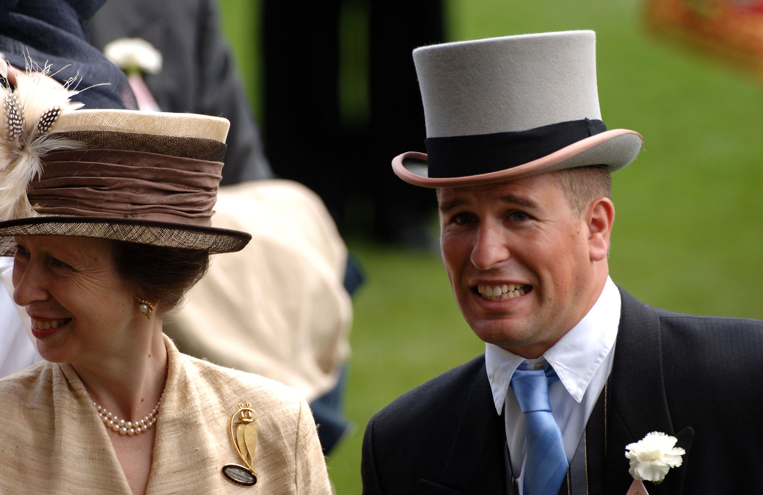 Photo taken of Princess Anne smiling while standing next to her son, Peter Phillips, at the Royal Ascot