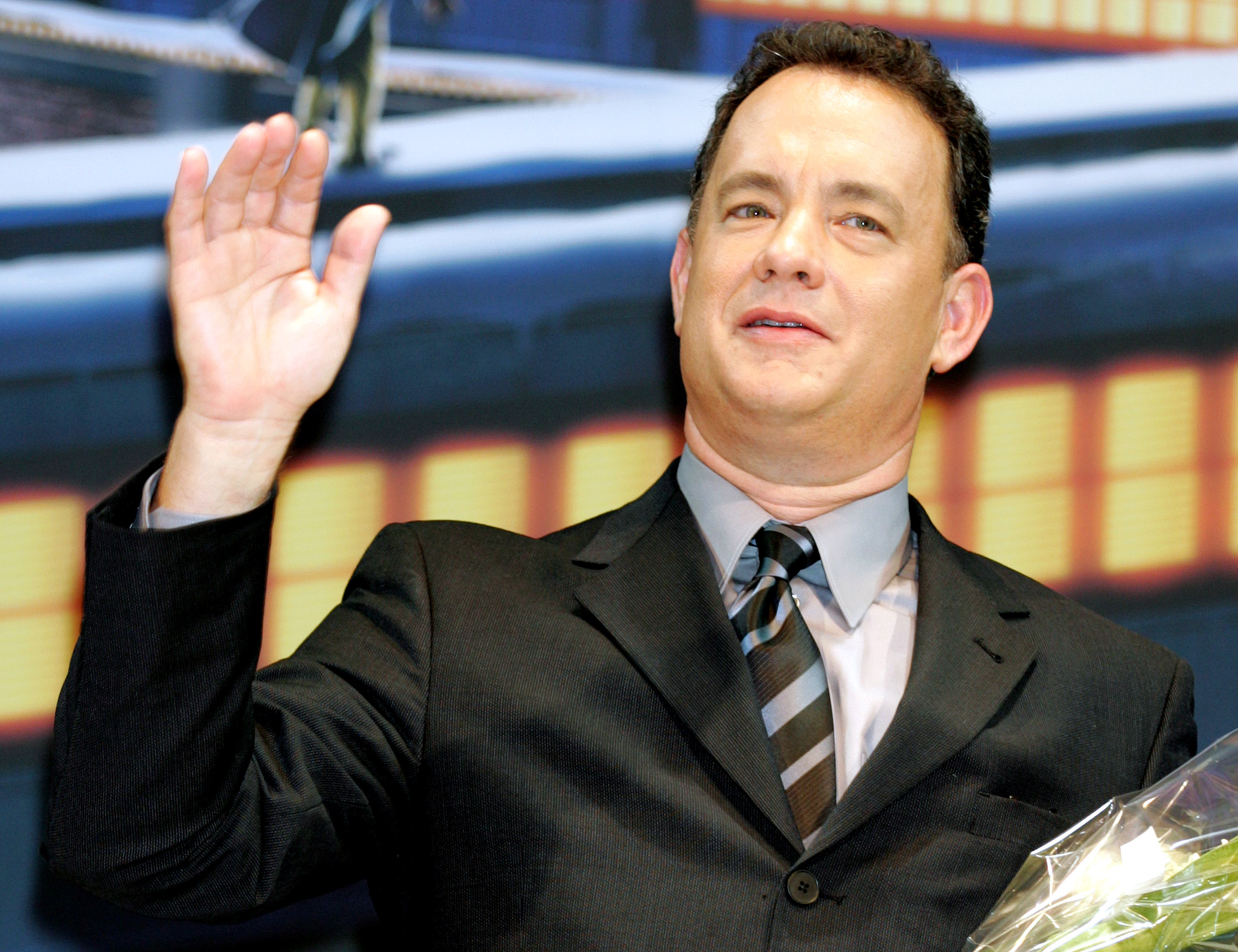 Polar Express star Tom Hanks raises his right hand
