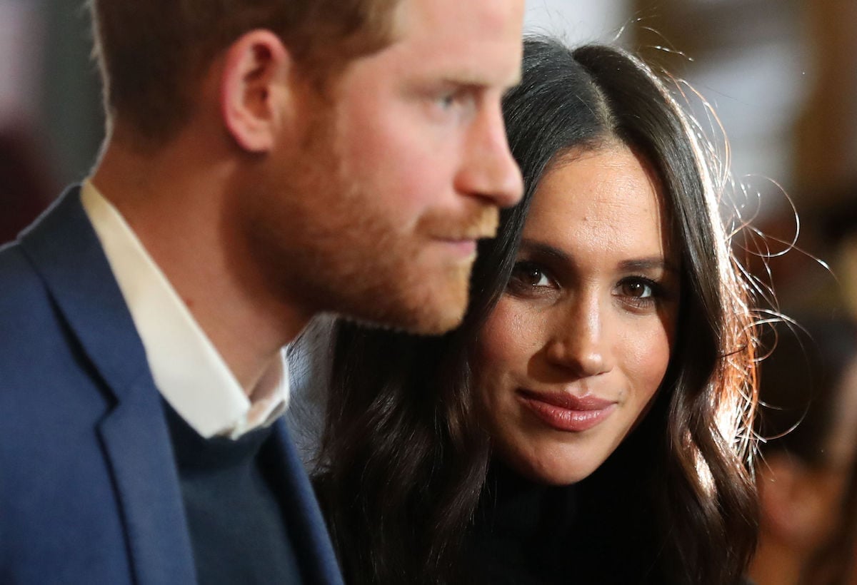 A close up of Prince Harry and Meghan Markle attending an event