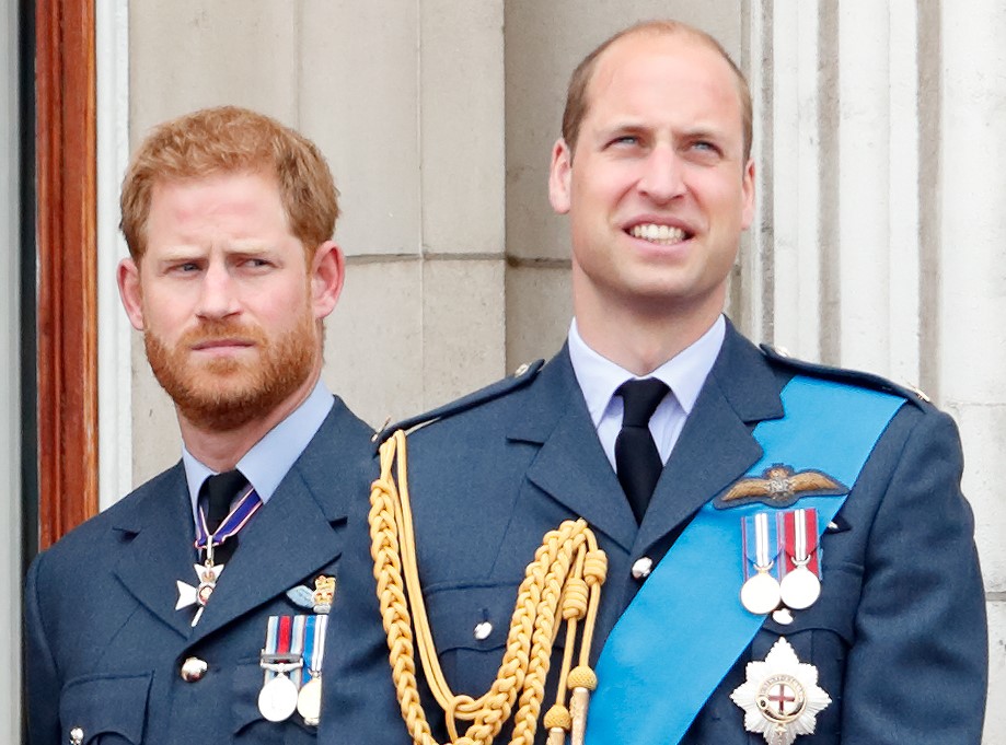 Prince Harry and Prince William standing on the Buckingham Palace balcony during a flypast to mark the centenary of the Royal Air Force