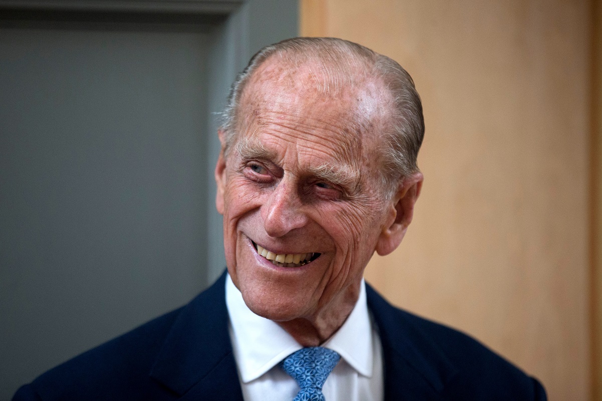 Prince Philip, Duke of Edinburgh, smiles after unveiling a plaque at the end of his visit to Richmond Adult Community College