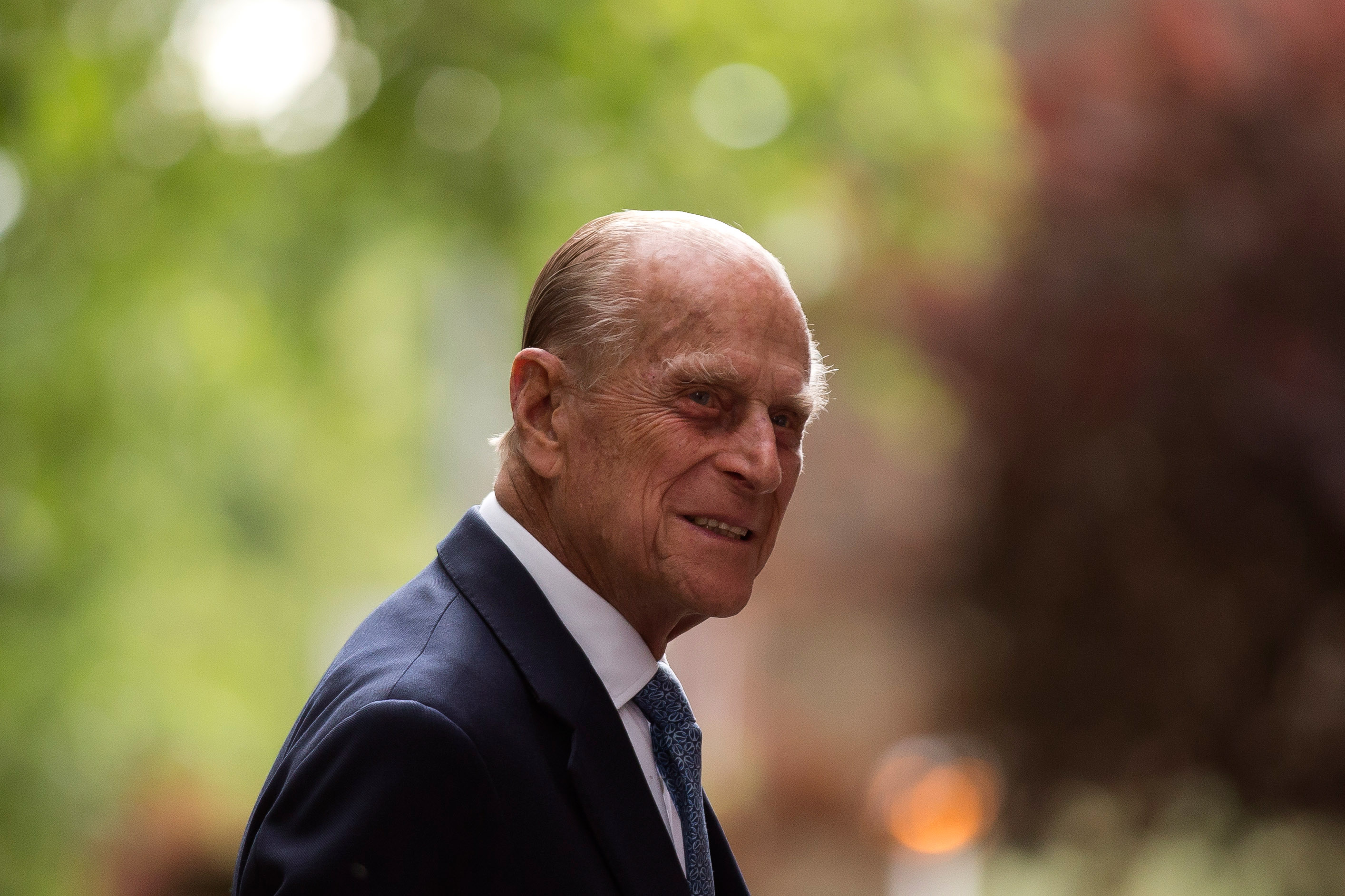 Prince Philip smiles for photo during visit to Richmond Adult Community College