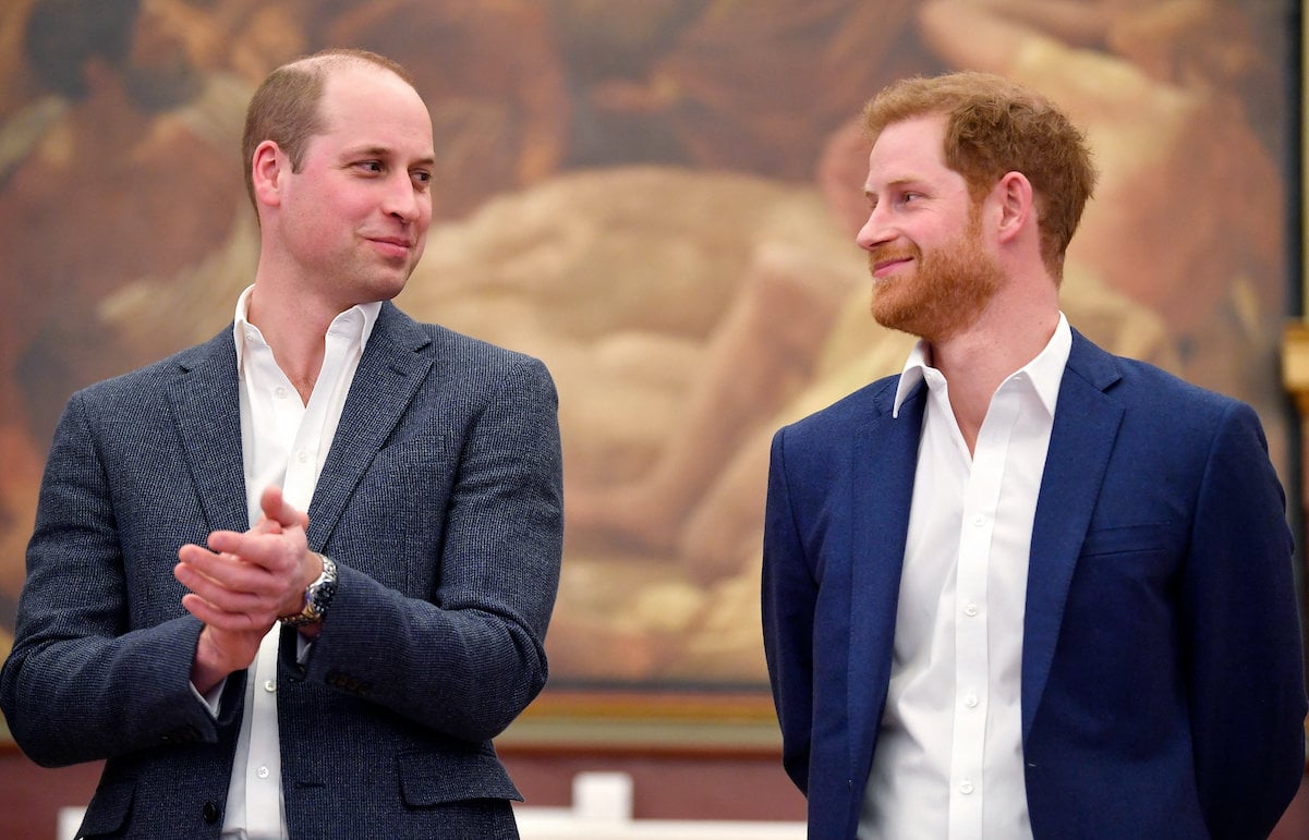 Prince William and Prince Harry share a smile in London in 2018