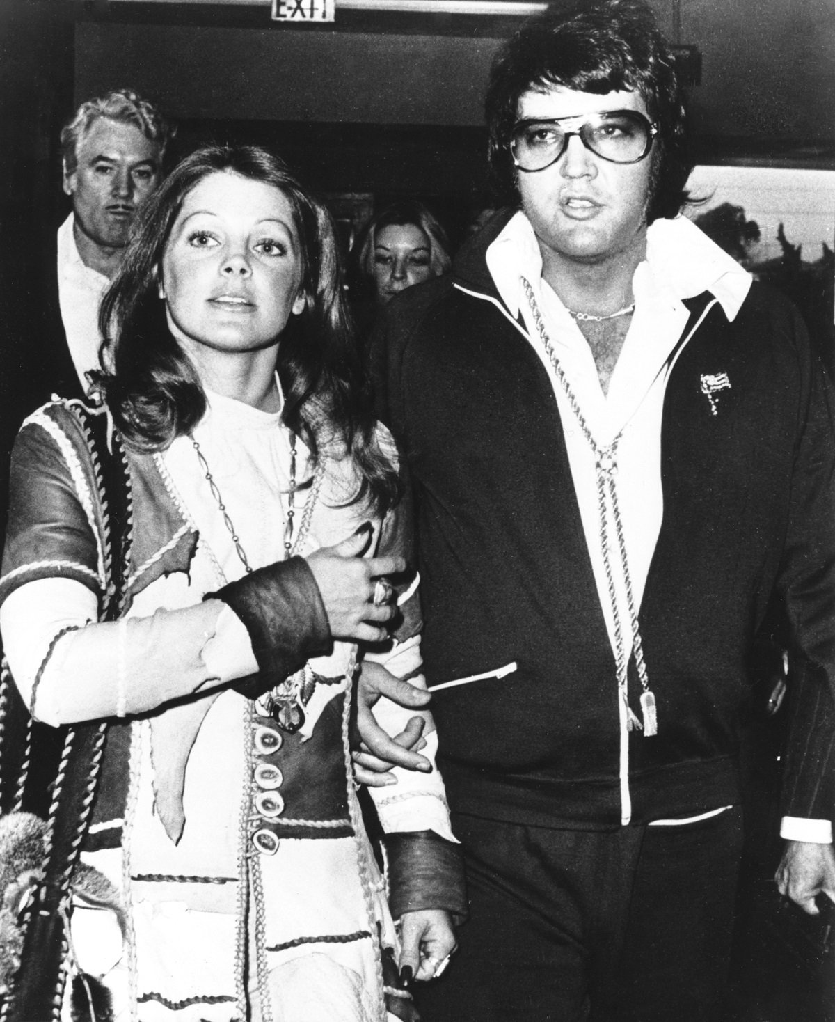 Elvis Presley and Priscilla Beaulieu Presley leaving divorce court hand in hand in 1973