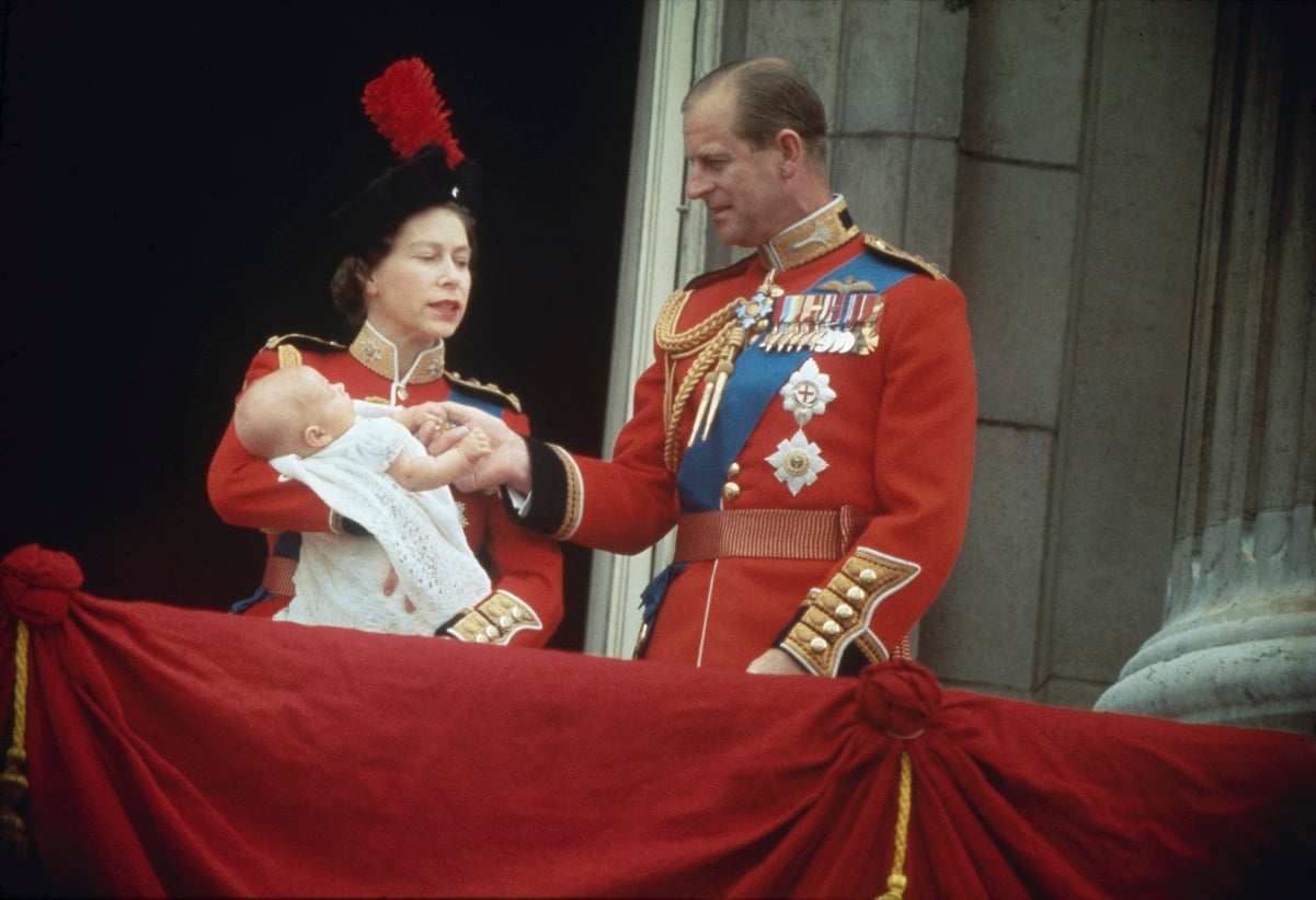 Queen Elizabeth II and Prince Philip with their baby son, Prince Edward, on the balcony at Buckingham Palace
