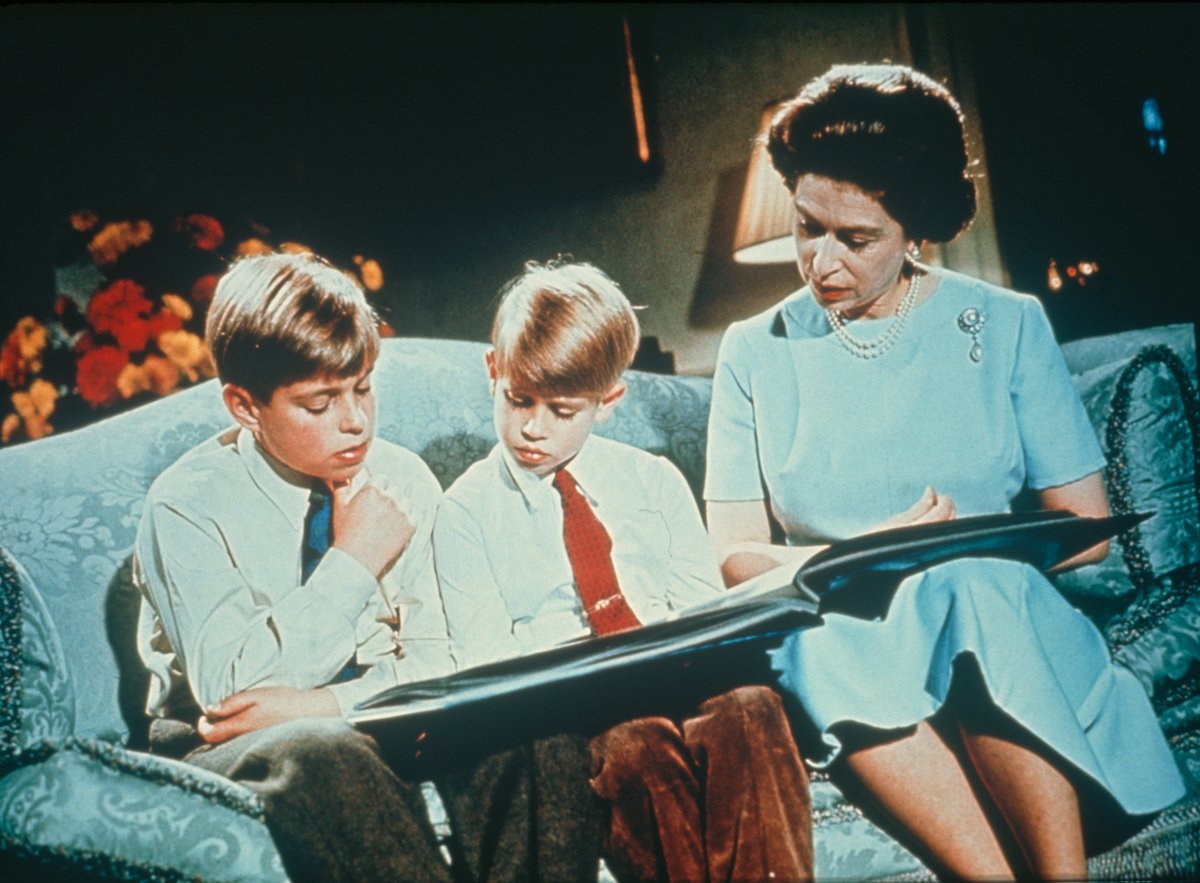 Queen Elizabeth with Andrew and Edward reading a book in December 1971