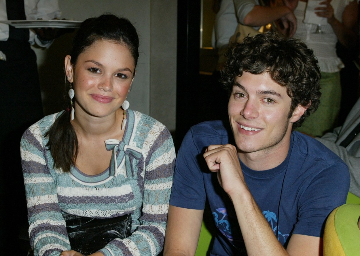 The O.C. cast members Rachel Bilson and Adam Brody smile for the camera at a preview party