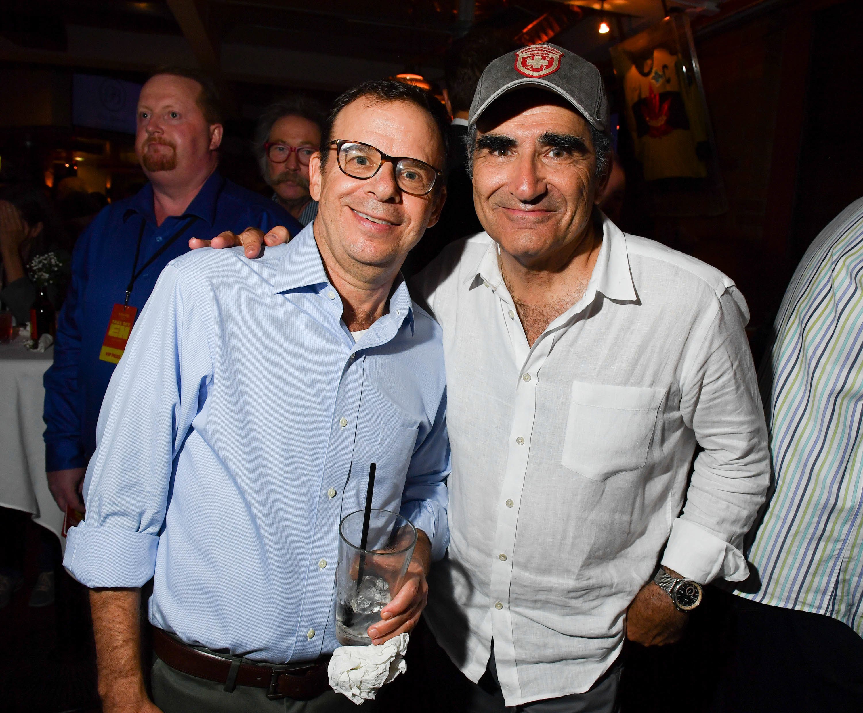 Rick Moranis and Eugene Levy at a party