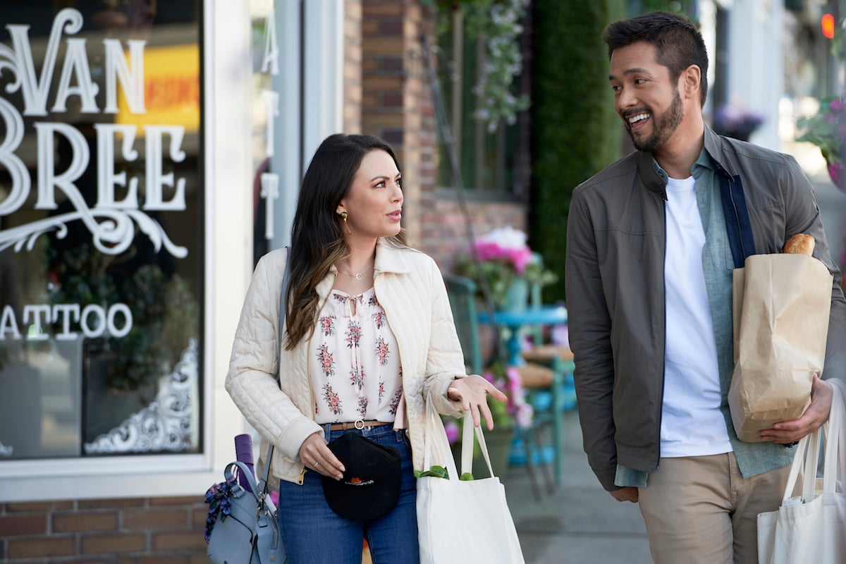 Man and woman walking down the street in the movie Right In Front of Me