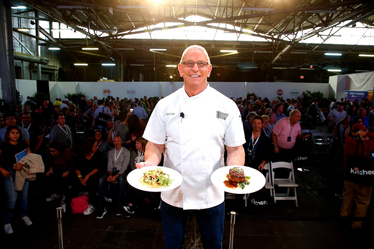 Chef Robert Irvine poses with food during culinary demonstration at the Grand Tasting presented by ShopRite featuring Culinary Demonstrations at The IKEA Kitchen presented by Capital One at Pier 94 on October 12, 2019 in New York City.