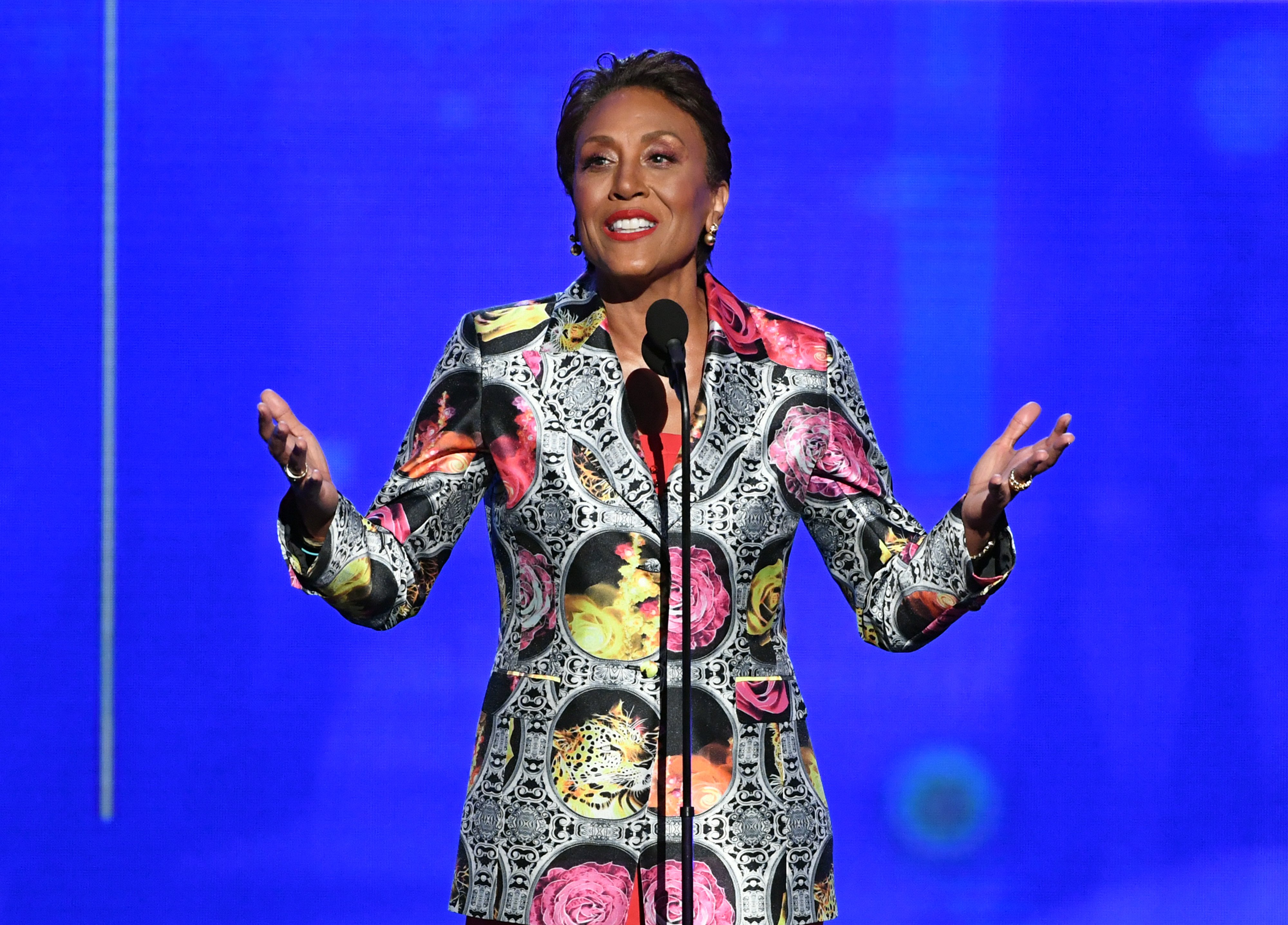 Robin Roberts of 'Good Morning America' in a multicolored dress standing at a microphone accepts the Sager Strong Award onstage during the 2019 NBA Awards presented by Kia on TNT at Barker Hangar