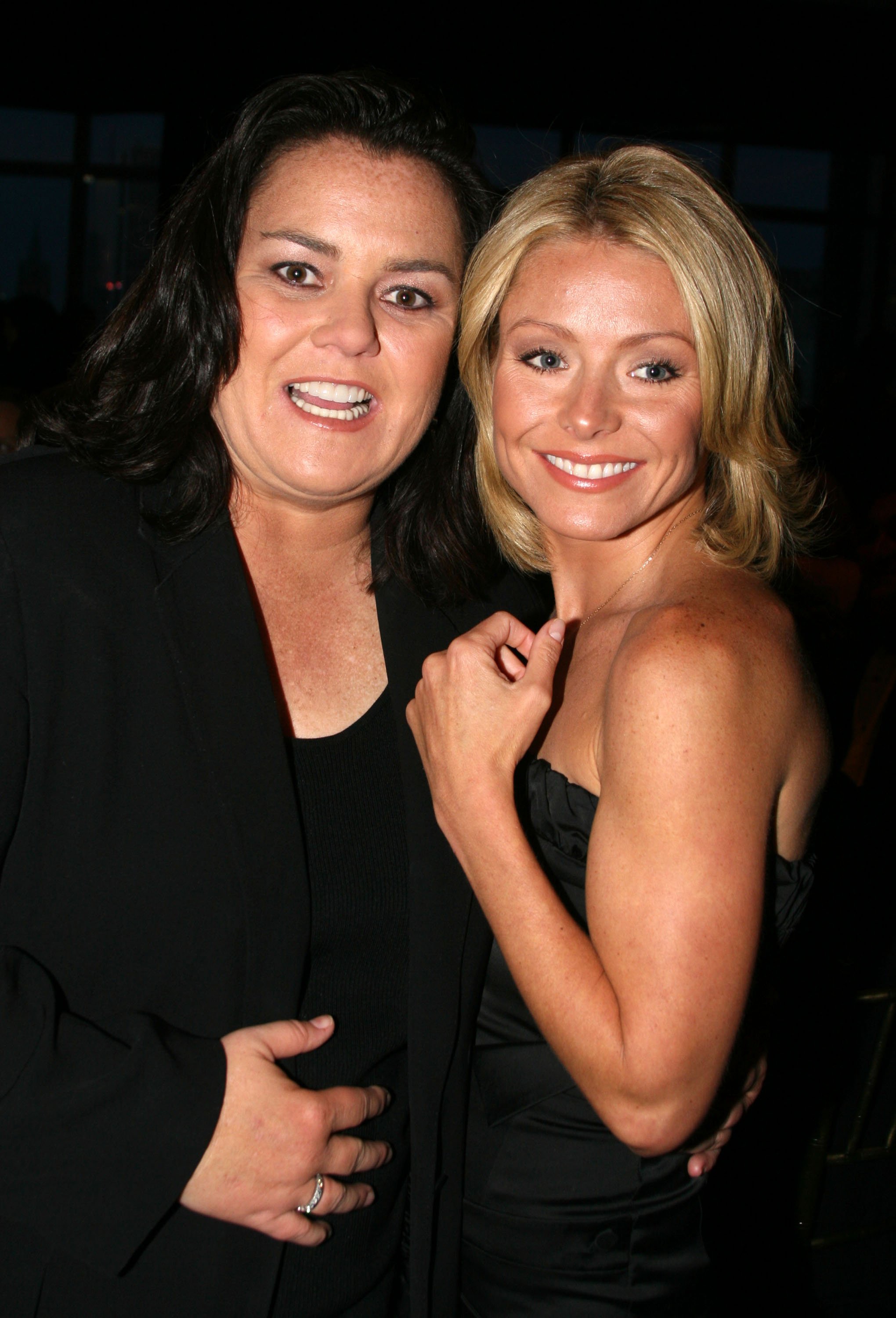 'The View' alum Rosie O'Donnell and 'Live with Kelly and Ryan' star Kelly Ripa stand arm-in-arm, both wearing black, during The Mandarin Oriental Hotel at Gilda's Club Annual Gala
