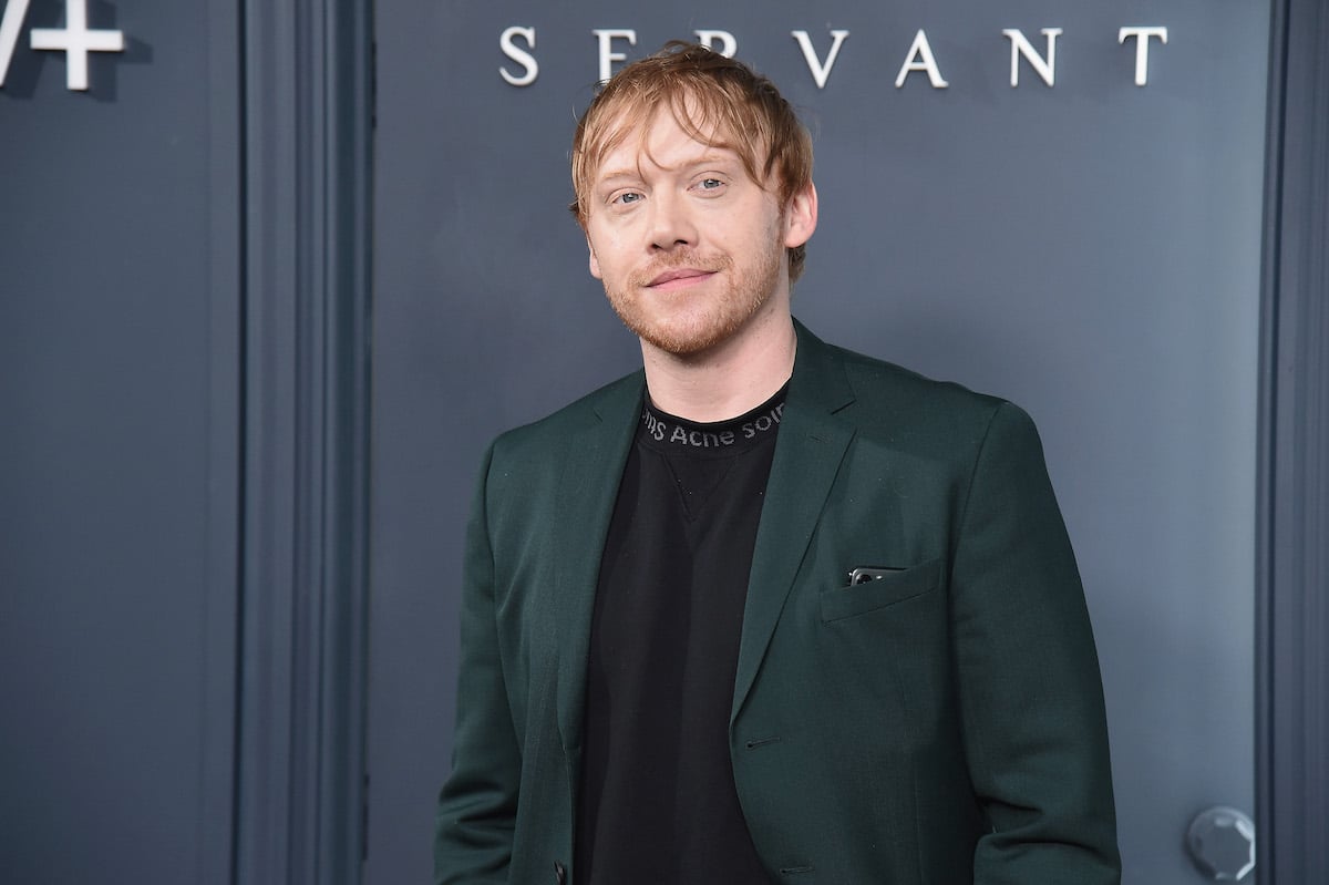 Rupert Grint poses for cameras at the premiere of 'Servant' in 2019