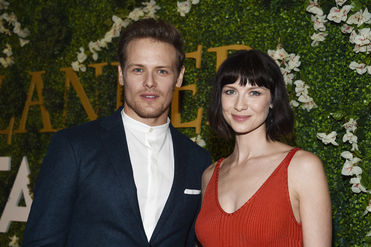 Actor Sam Heughan (L) and actress Caitriona Balfe arrive at Starz's "Outlander" FYC Special Screening