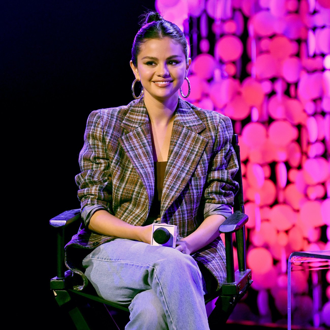 Selena Gomez speaks on stage at the iHeartRadio Album Release Party