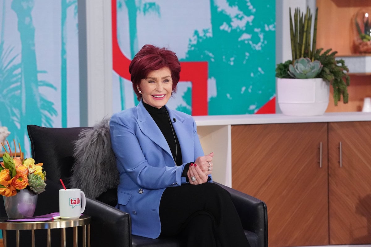 Sharon Osbourne sits on the set of 'The Talk' smiling