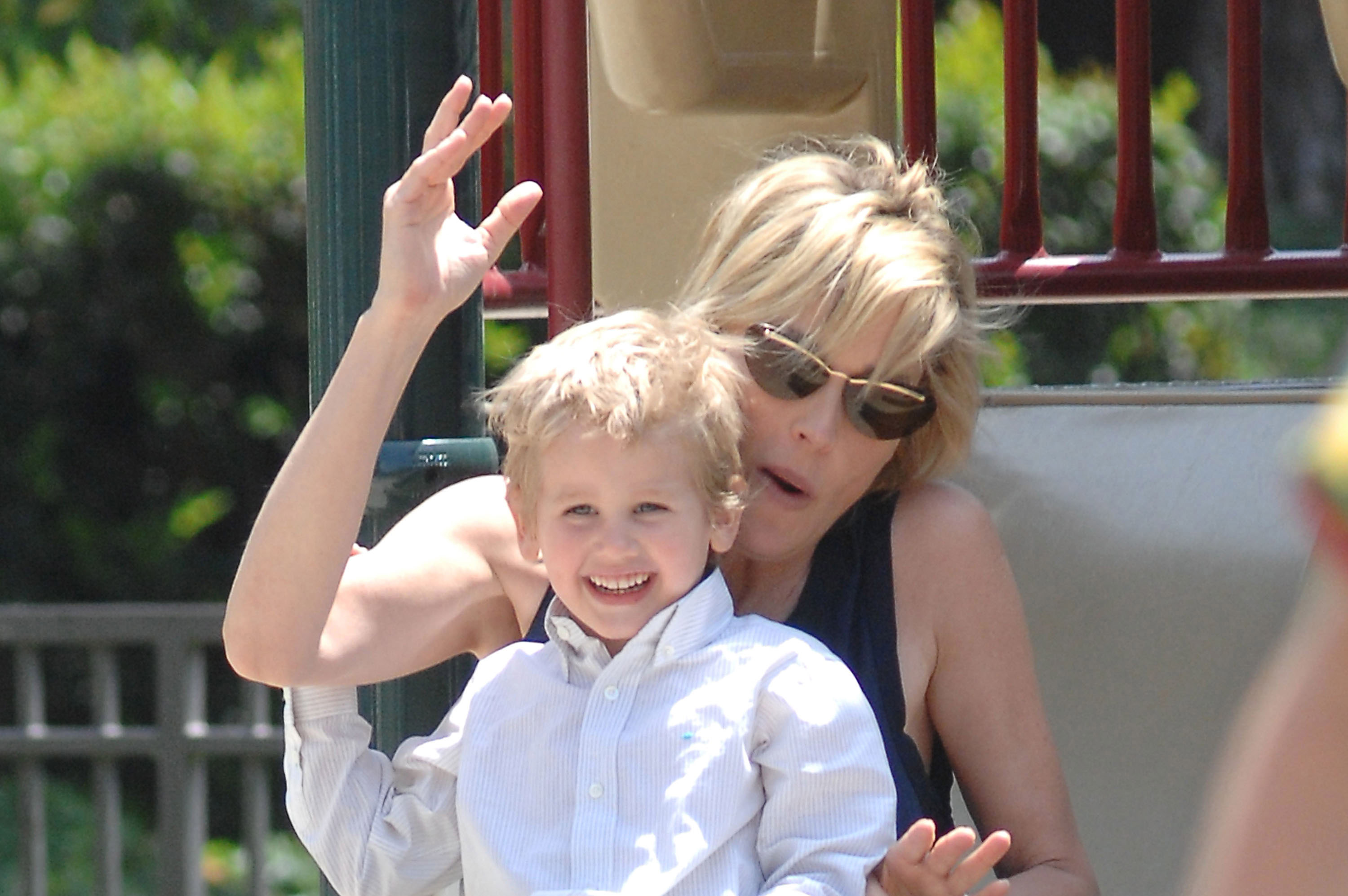 Sharon Stone plays with her son, Laird, on a slide