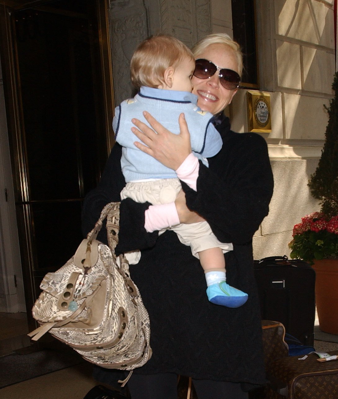 Sharon Stone carries her baby, Laird