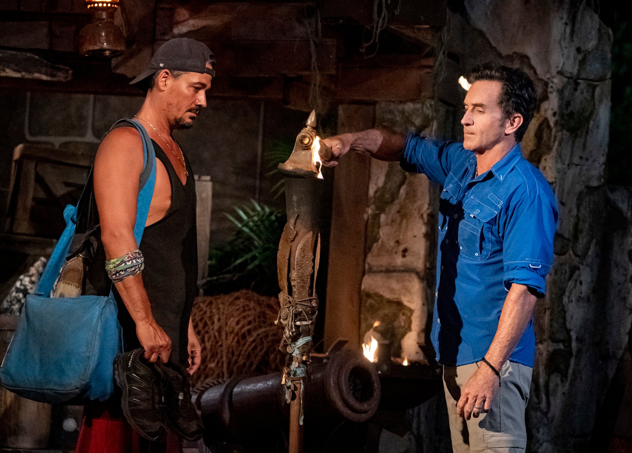 Jeff Probst, the host of 'Survivor Season 41,' Rob Mariano's Torch in the dark at Tribal Council on 'Survivor'