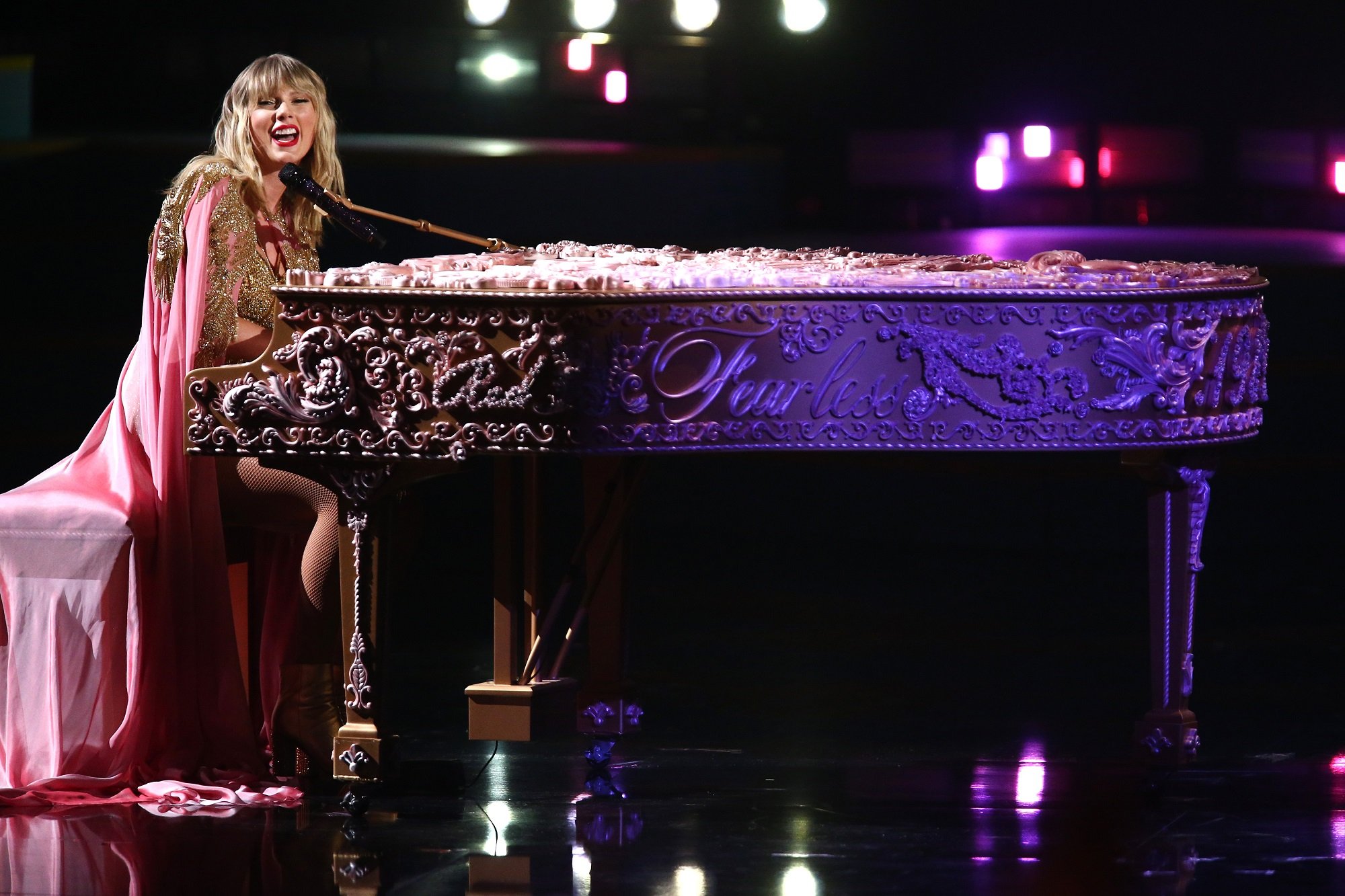 Taylor Swift performs while playing the piano during the 2019 American Music Awards