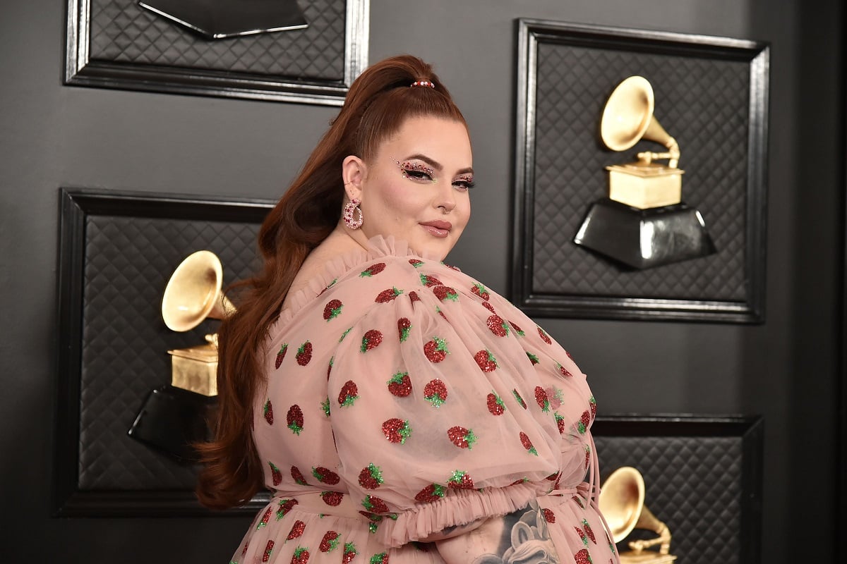 Tess Holliday attends the 62nd Annual Grammy Awards in Lirika Matoshi's Strawberry Midi Dress at Staples Center on January 26, 2020 in Los Angeles, CA.