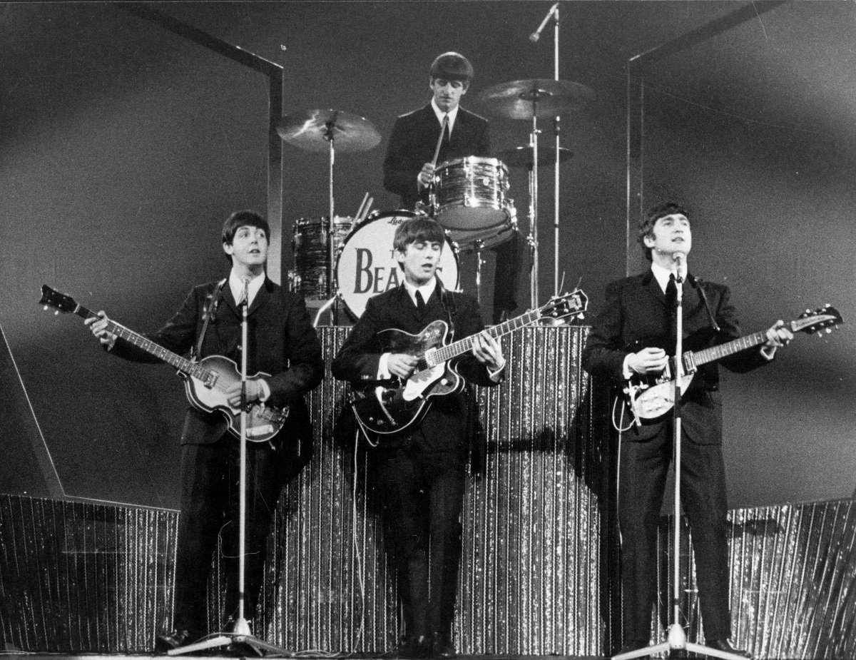 The Beatles perform at the London Palladium with Ringo Starr on drums, rear, and (L to R): Paul McCartney, George Harrison, and John Lennon on bass guitar, lead guitar, and rhythm guitar, respectively