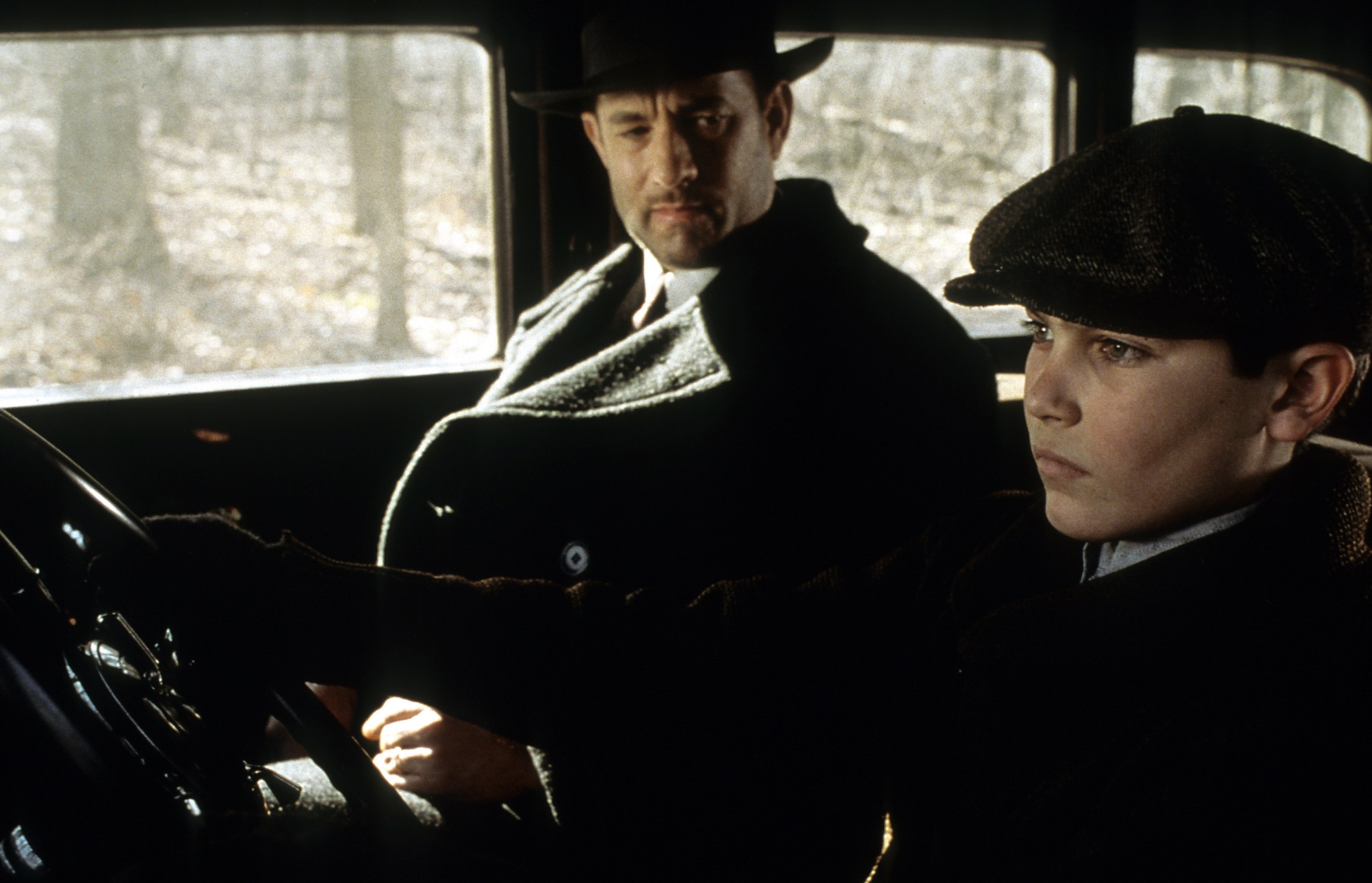Tom Hanks and Tyler Hoechlin sitting in a car