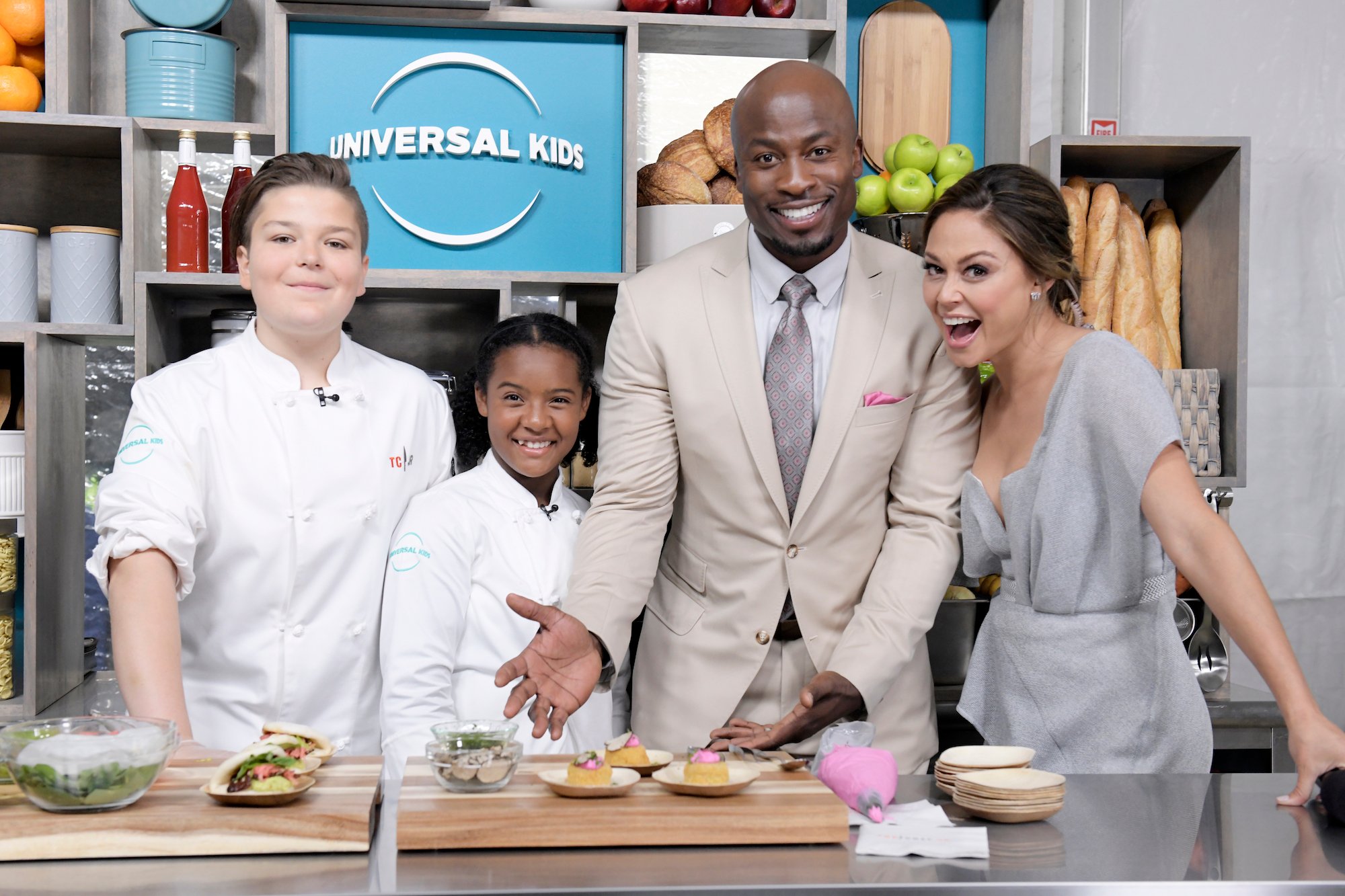 (L-R) Milo Fleming, Rahanna Martinez, "Top Chef Junior" on Universal Kids; Akbar Gbaja-Biamila, "American Ninja Warrior" on NBC; Vanessa Lachey around a kitchen counter