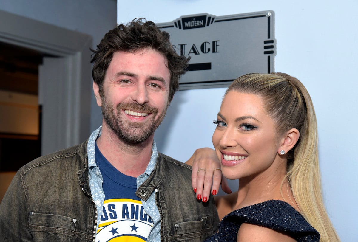 Beau Clark and  Stassi Schroeder pose backstage before a live 2019 show