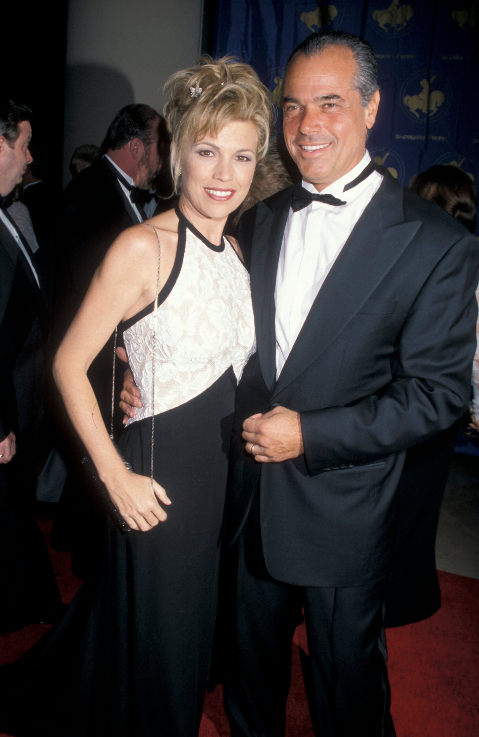  Vanna White and then-husband George Santopietro smiling at benefit together