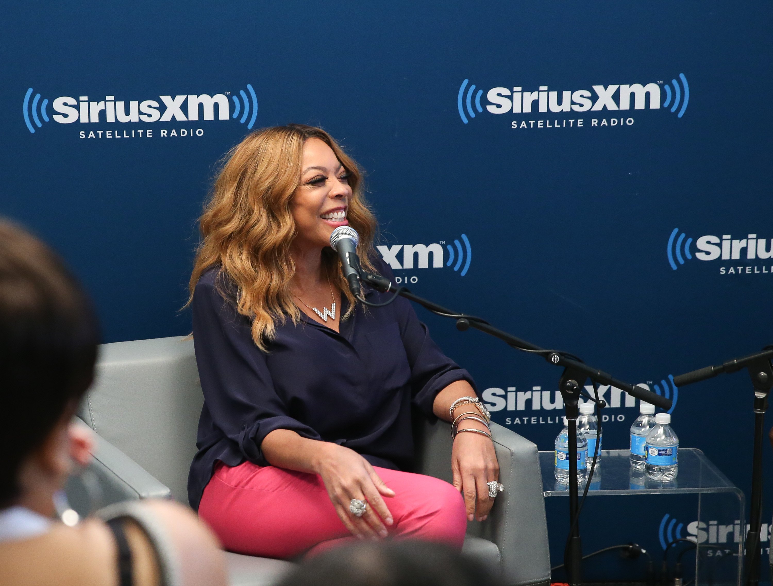 Wendy Williams smiling during a Sirius XM radio interview