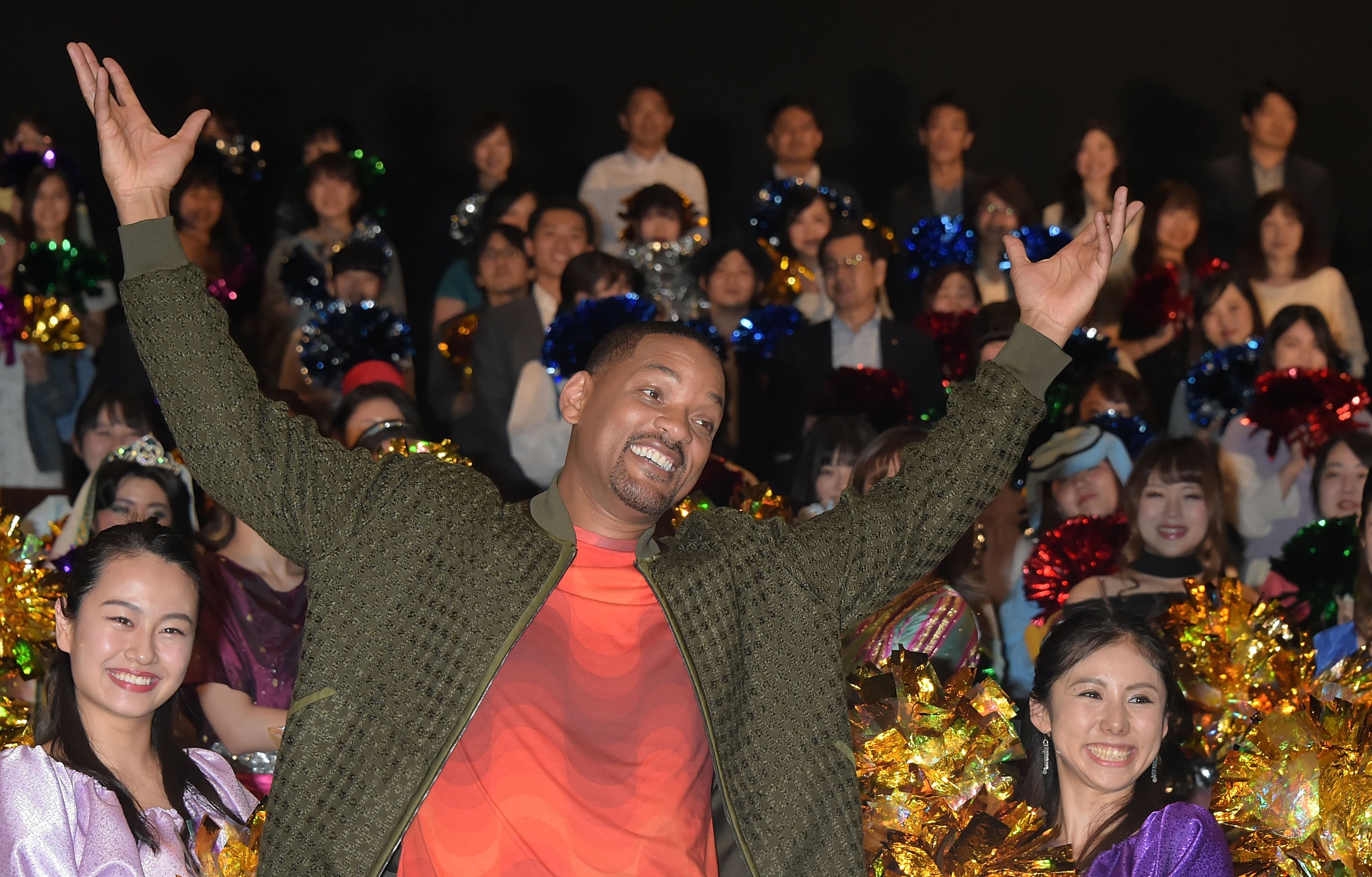 Will Smith raises arms in front of Tokyo fans