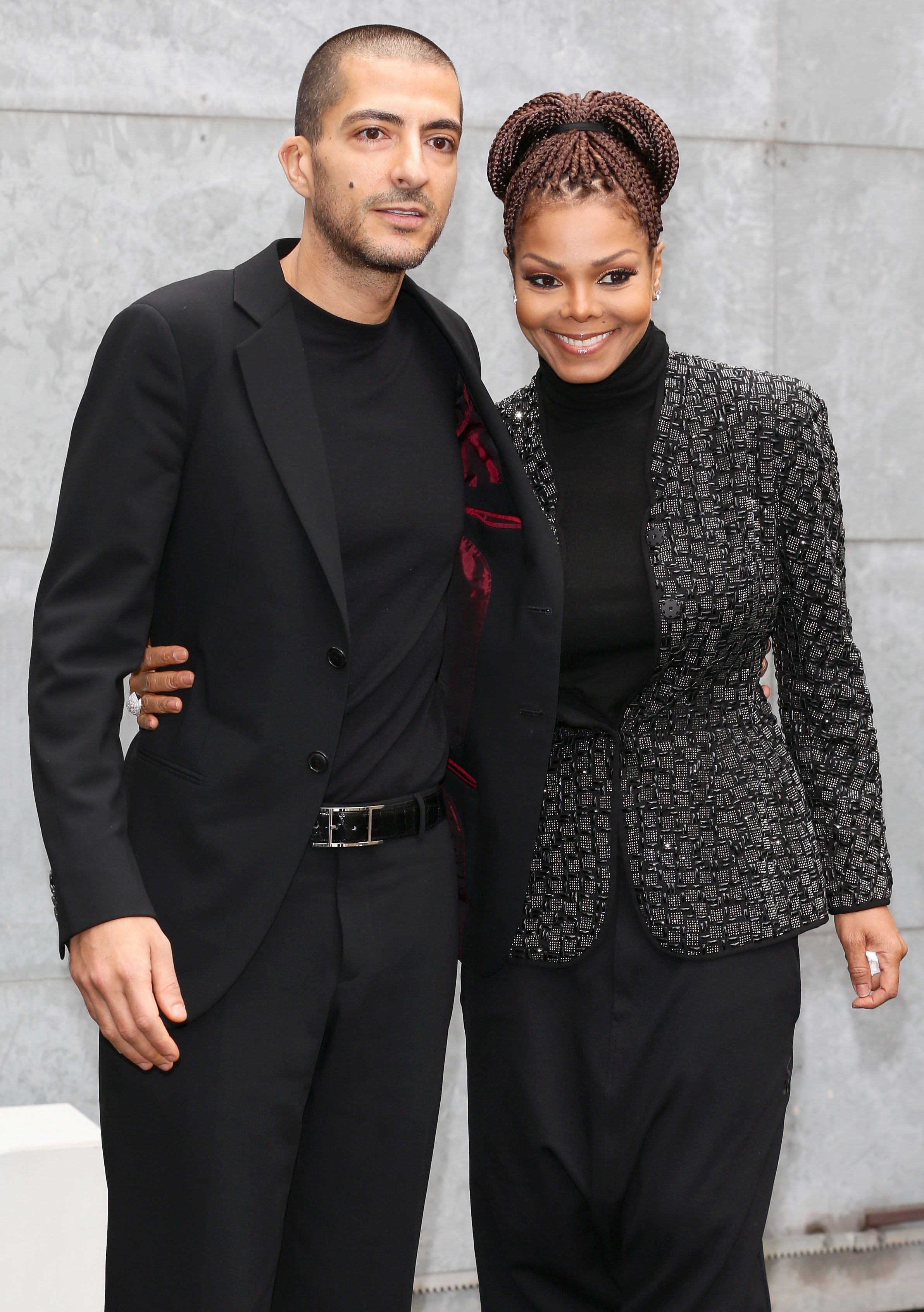 Wissam al Mana and Janet Jackson pose together at Giorgio Armani fashion show in 2013