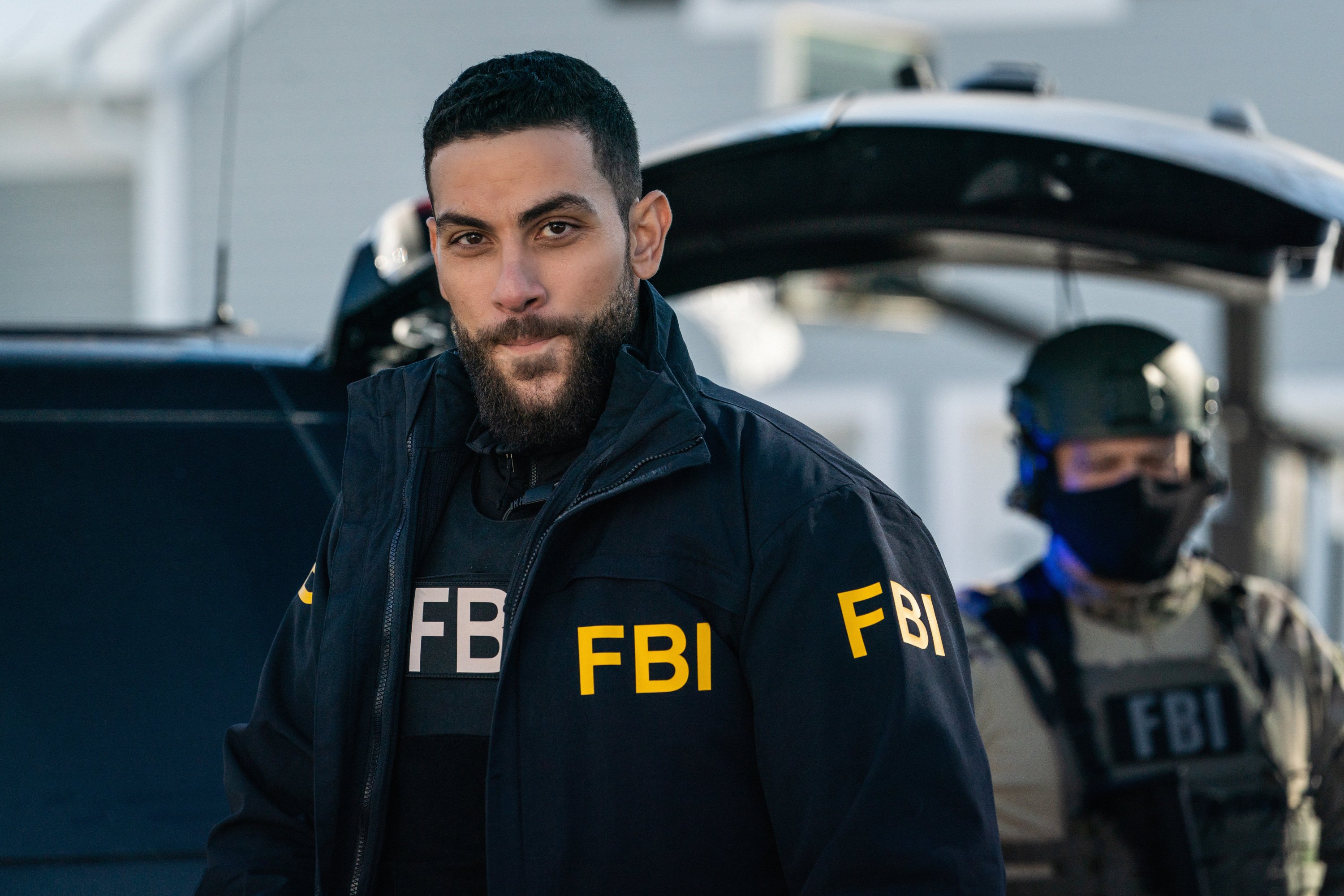 Zeeko Zaki wearing FBI jacket