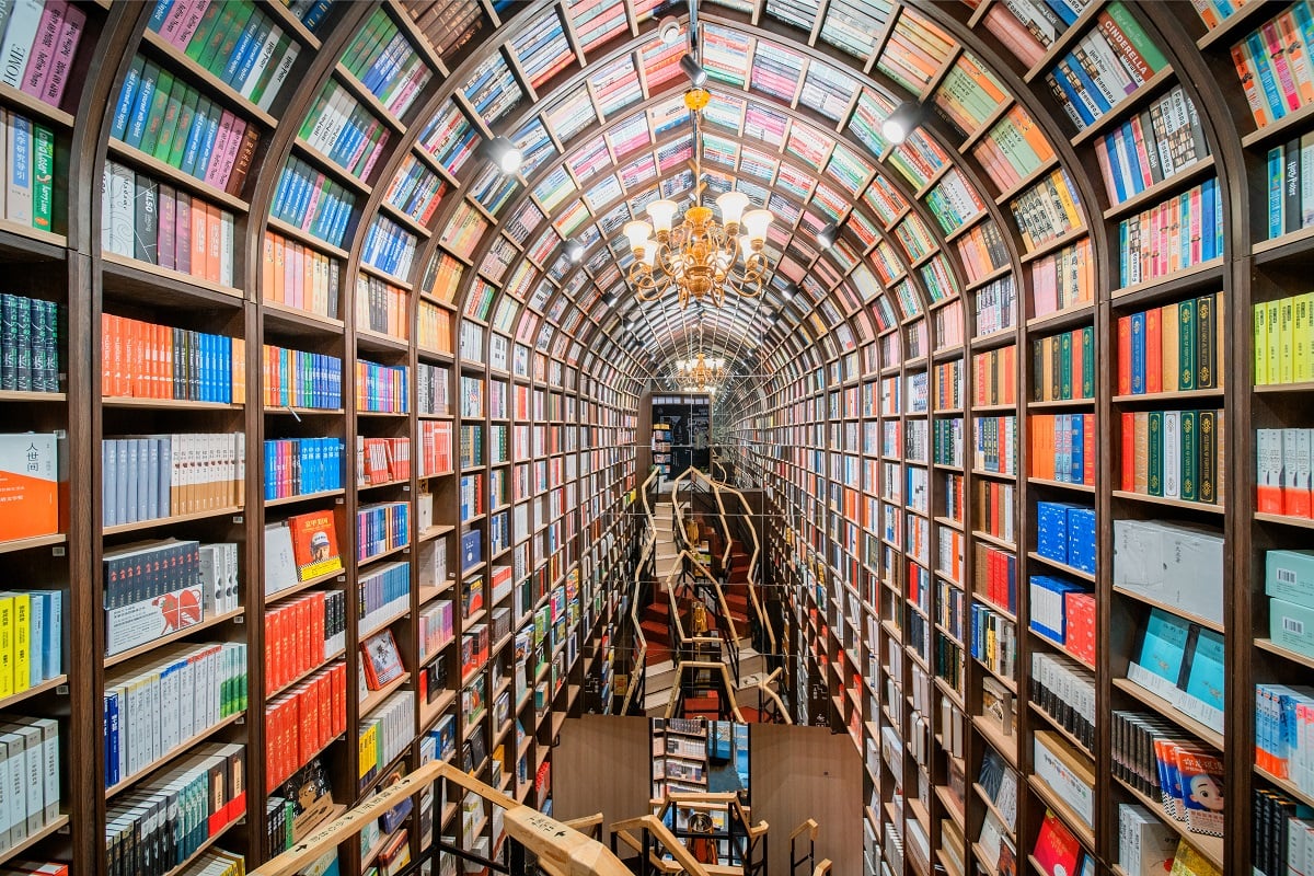 The arched interior of the Zhongshuge bookstore in Beijing in 2020 with colorful shelves of books