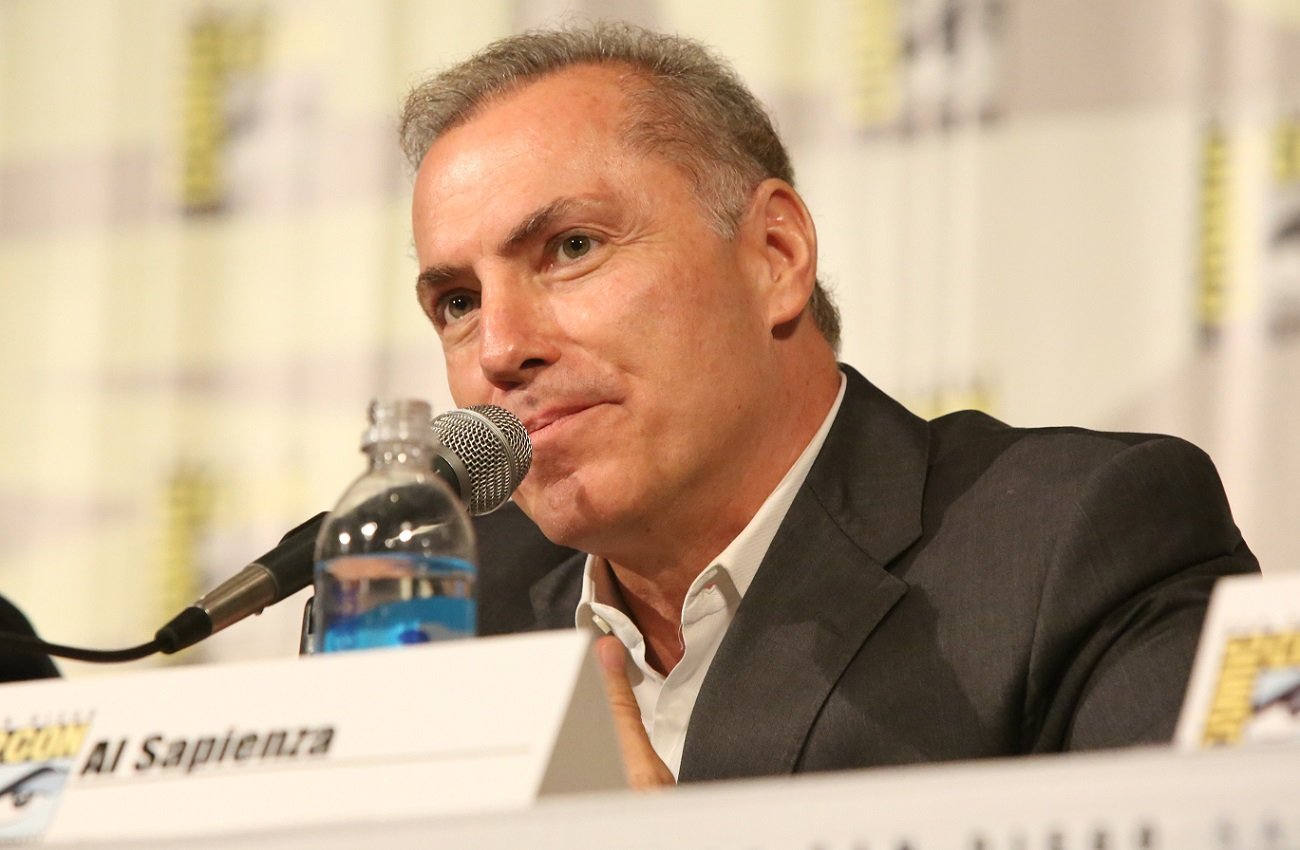 Al Sapienza speaks into a microphone at Comic-Con