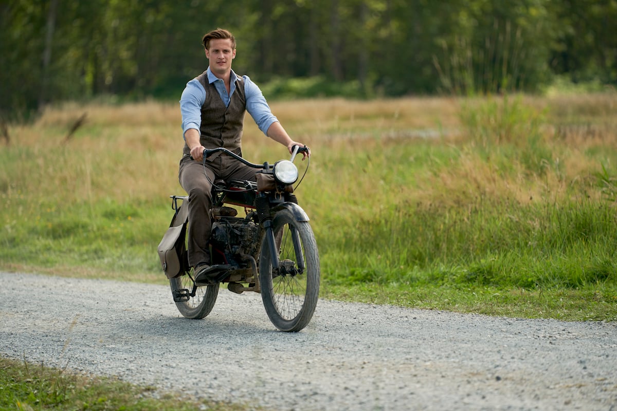 Jesse (Aren Buchholz) riding a motorcycle in When Calls the Heart