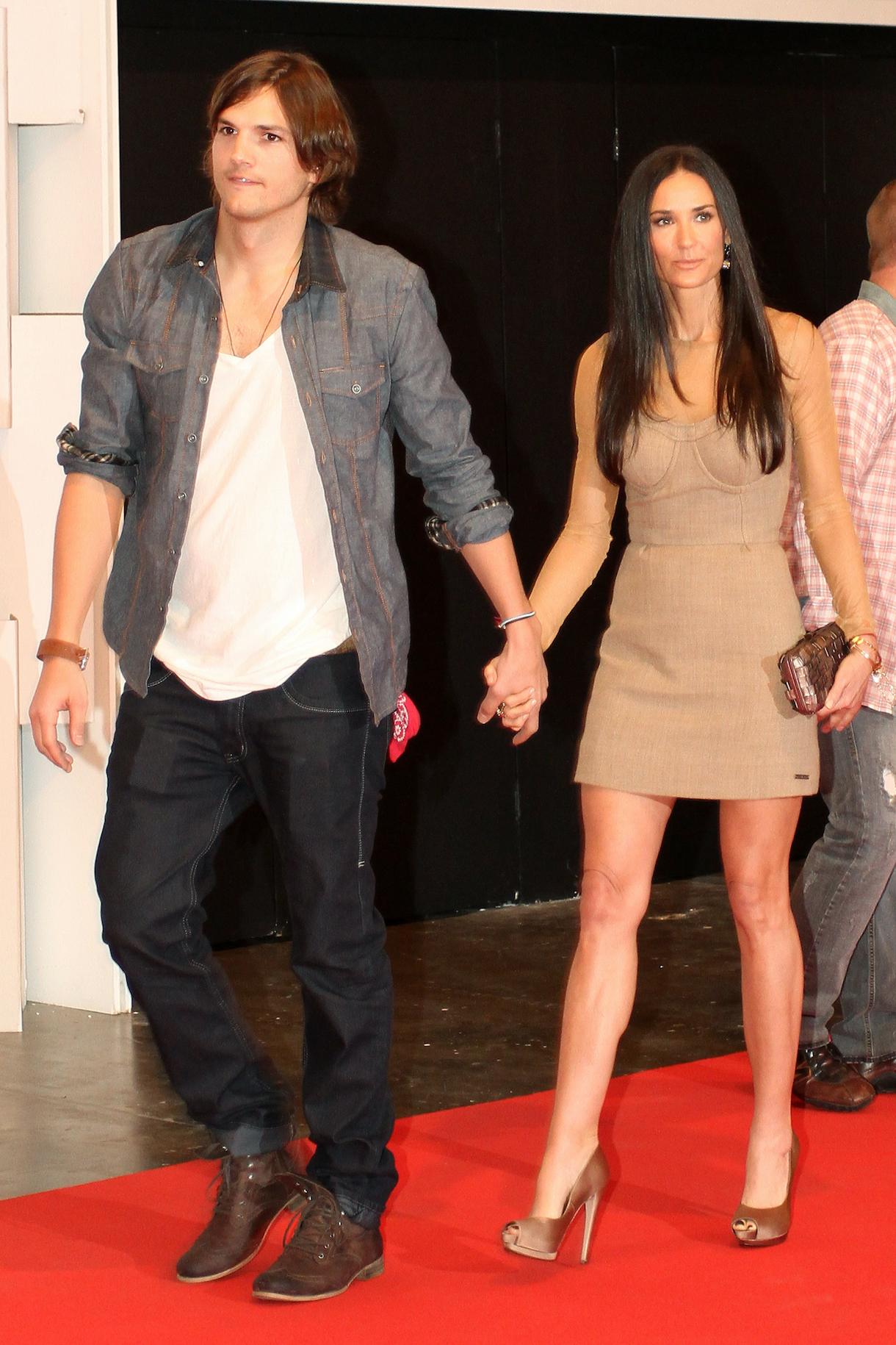 Ashton Kutcher and Demi Moore attend the Colcci fashion show during the third day of Sao Paulo Fashion Week Fall 2011