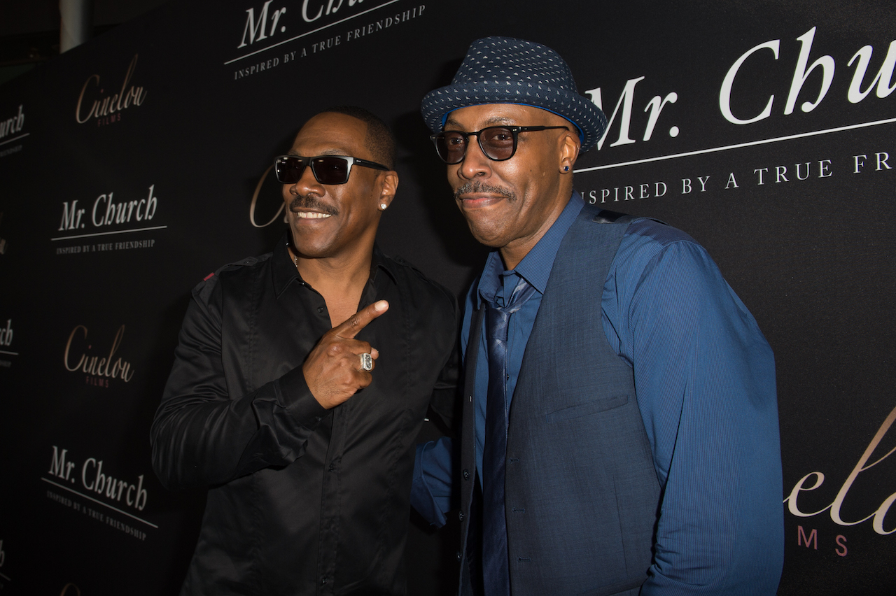 Eddie Murphy (L) and actor/comedian Arsenio Hall attend the premiere of Cinelou Releasing's 'Mr. Church'