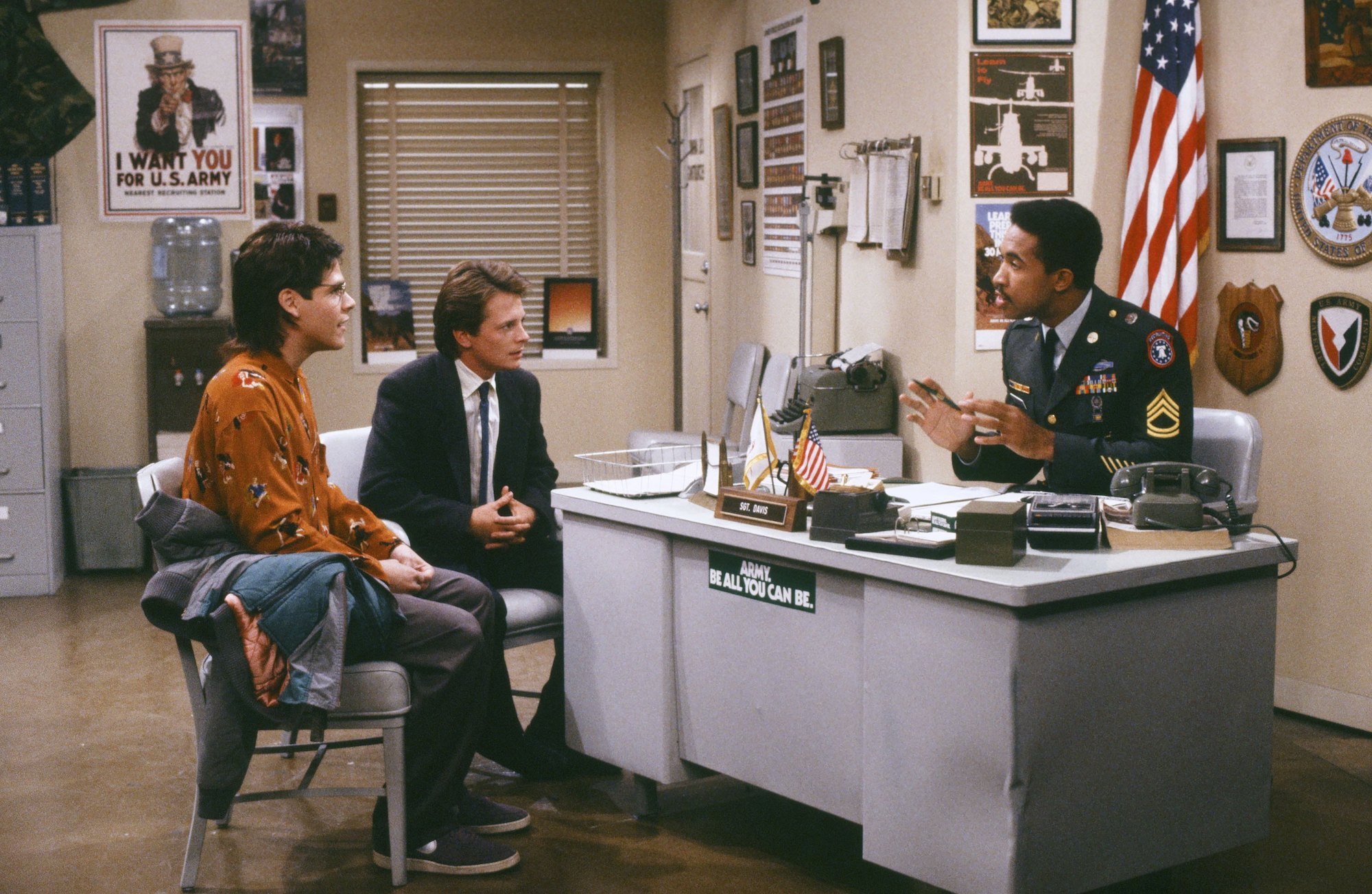 Marc Price as Irwin "Skippy" Handleman, Michael J. Fox as Alex P. Keaton, John Marshall Jones as Sgt. Tom Davis