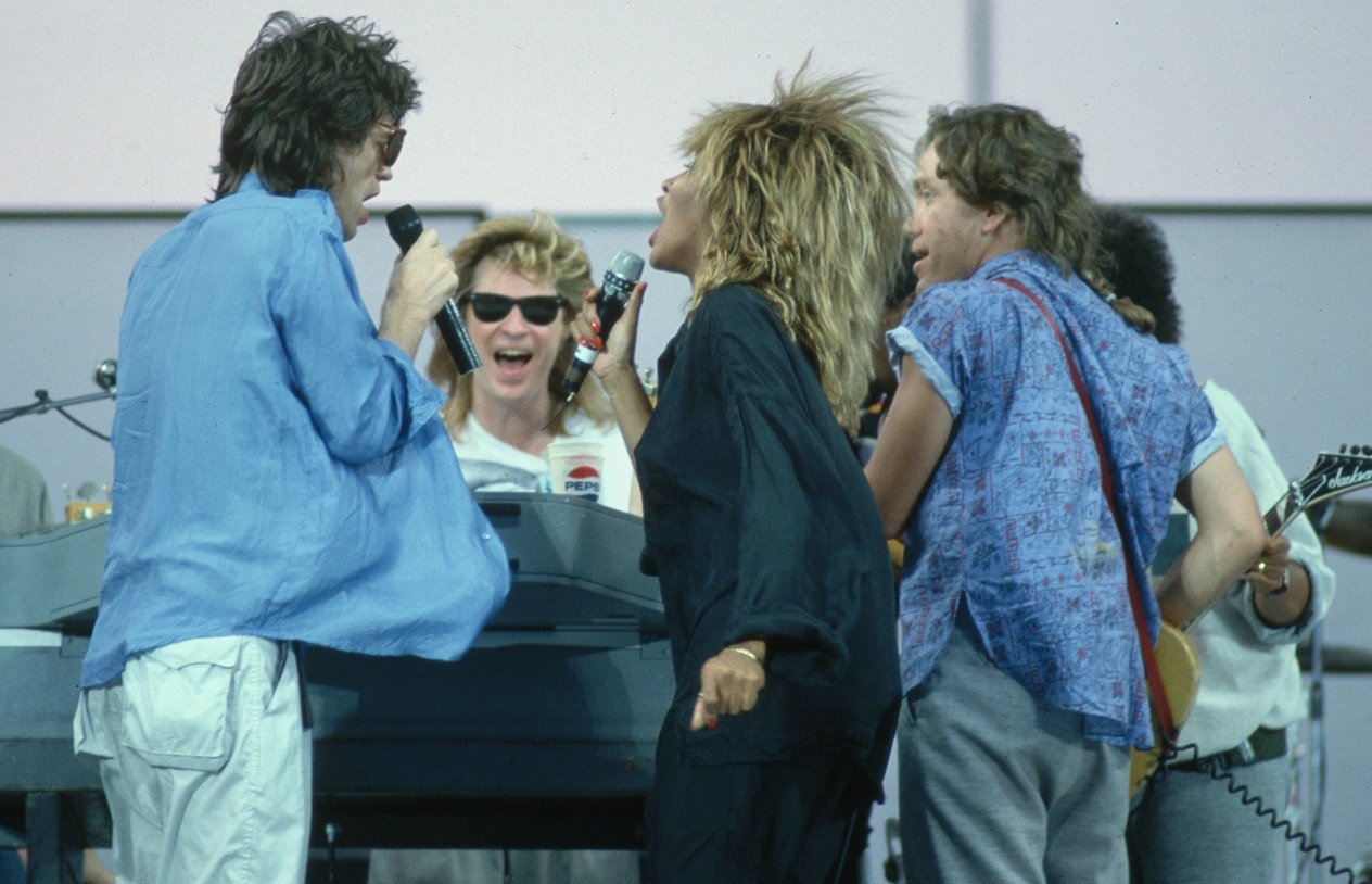 Mick Jagger, Tina Turner, Daryl Hall, and G.E. Smith rehearse on stage for 'Live Aid.'